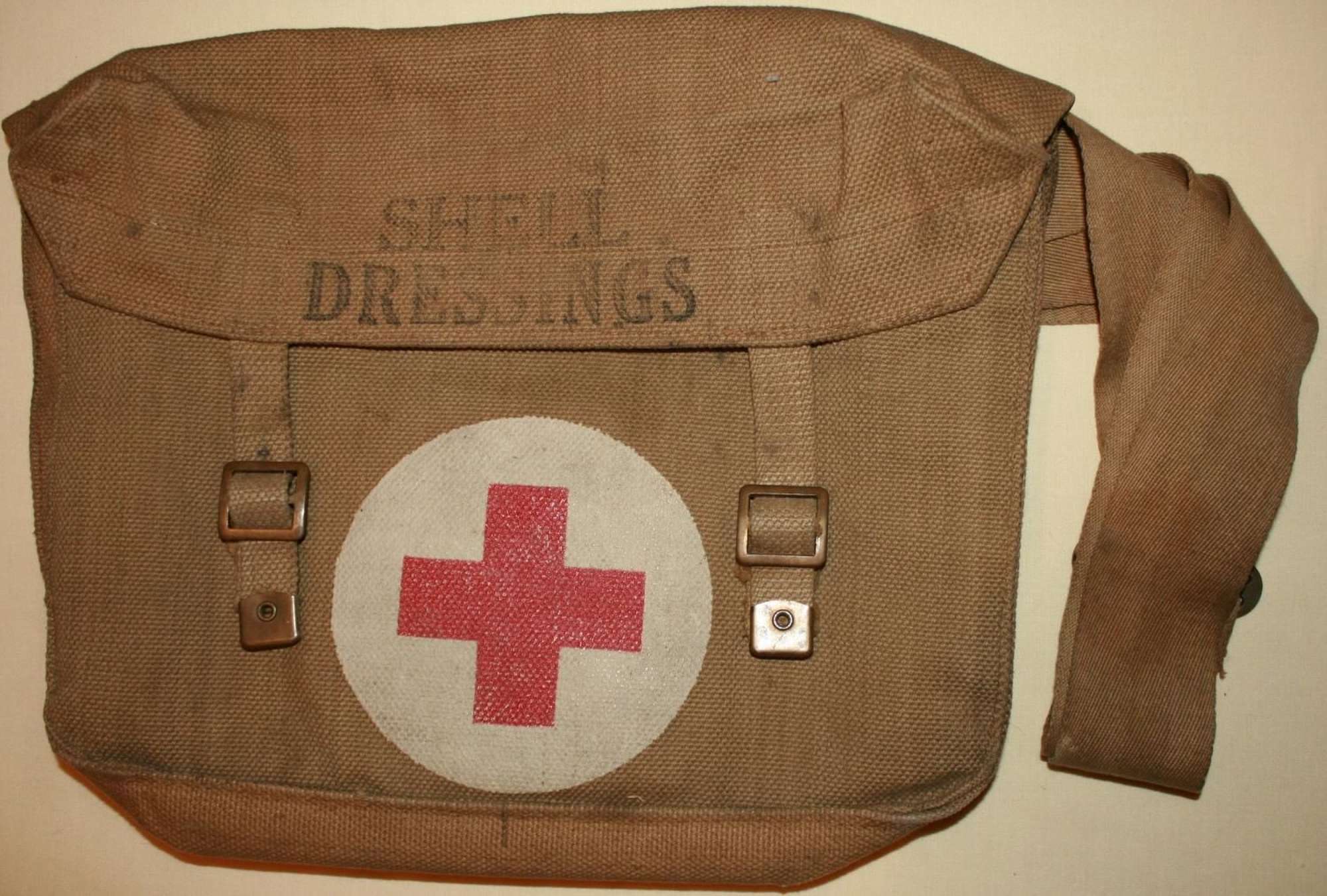 A GOOD USED WWII SHELL DRESSING BAG 1942 DATED