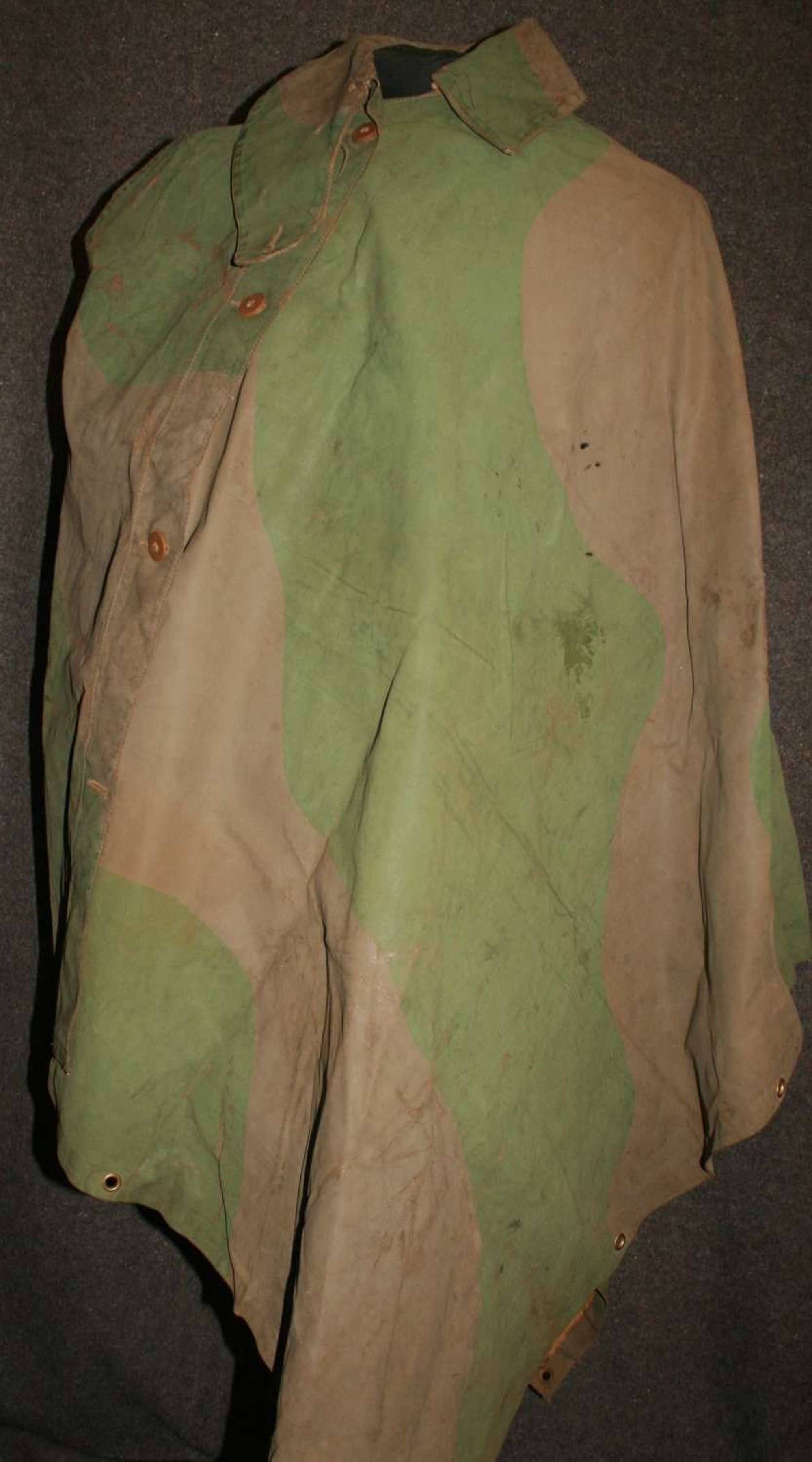 A WELL USED EARLY WAR CAMOUFLAGE CAPE