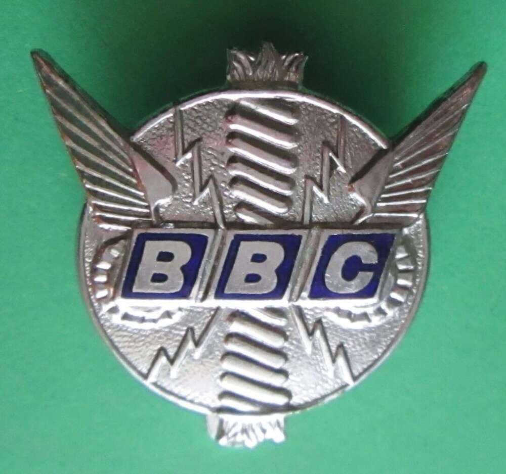 A vintage British Broadcasting Company cap badge