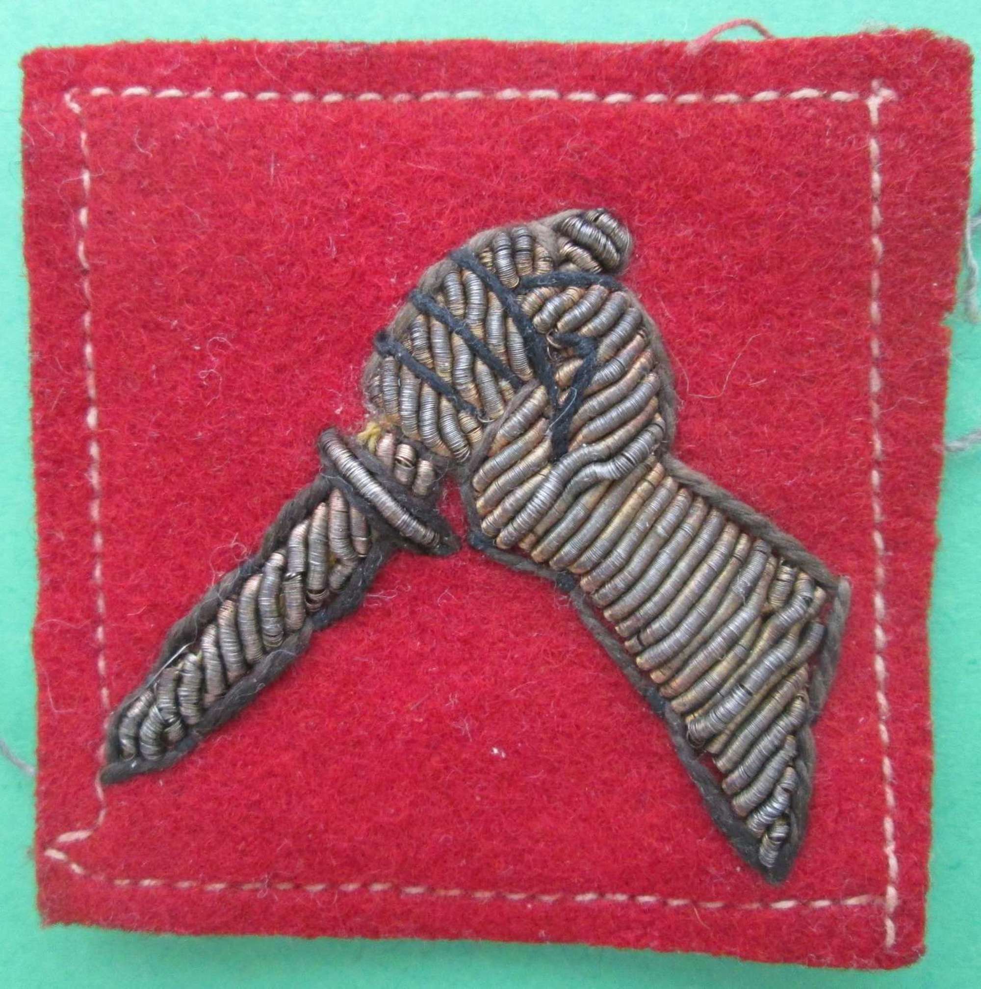 A 19TH INDIAN DIVISION FORMATION SIGN IN BULLION WIRE