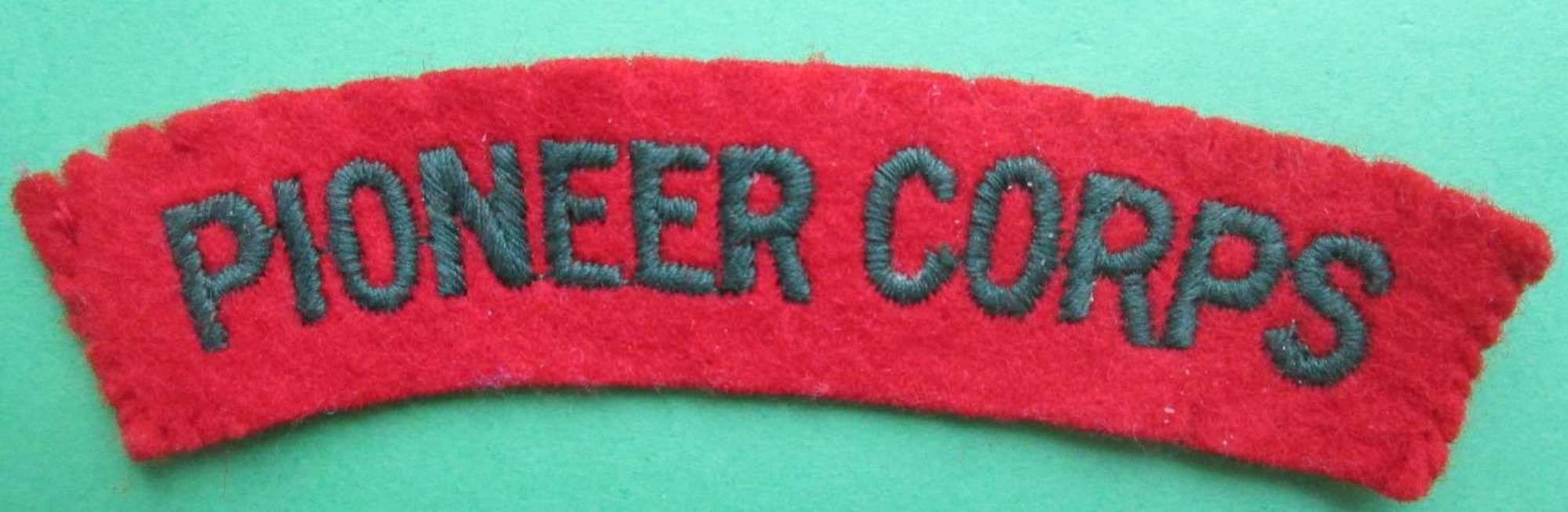 A GOOD USED PASTE BACK EMBROIDERED PIONEER SHOULDER TITLE