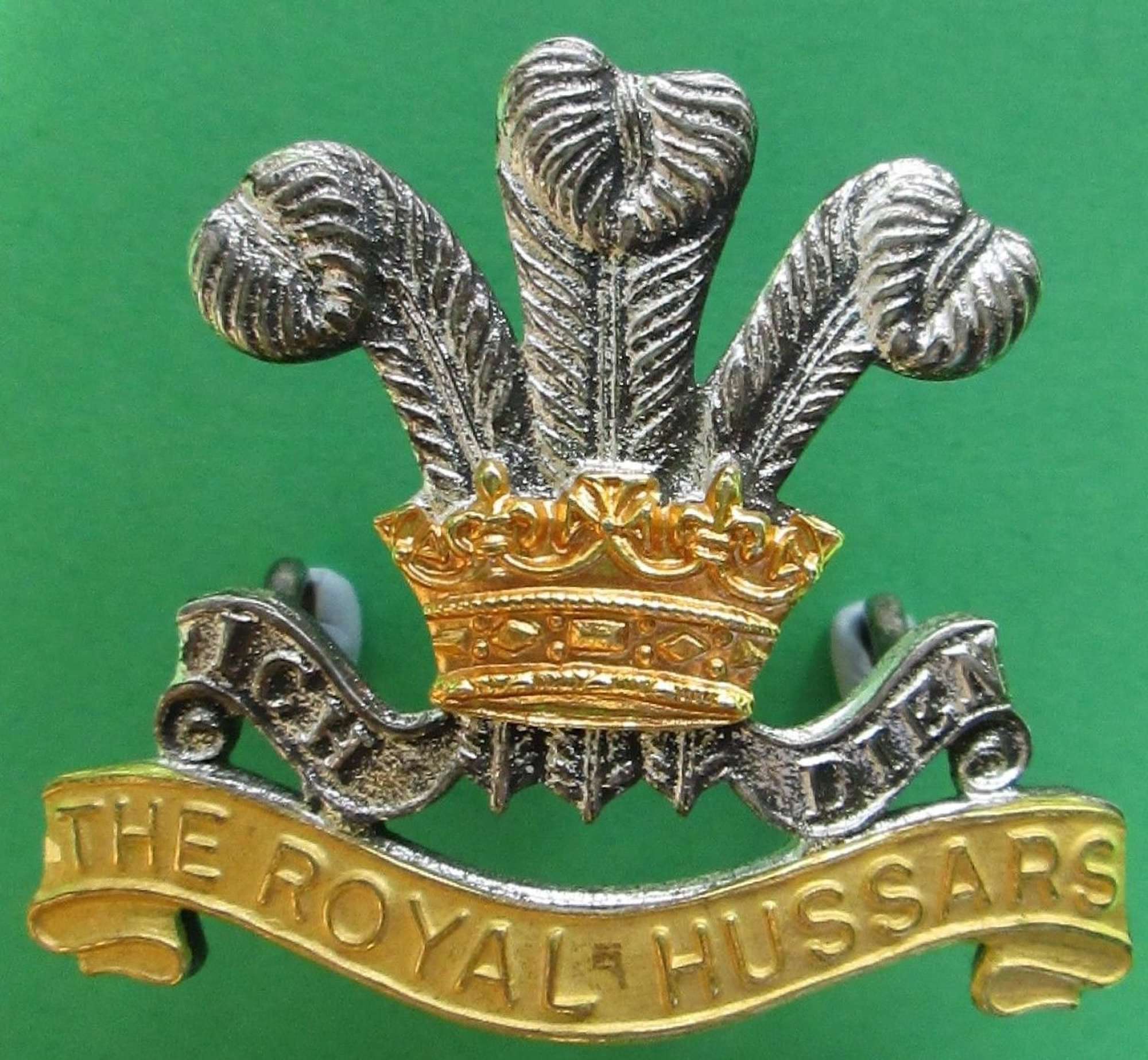 A OFFICERS SILVER AND GILT ROYAL HUSSARS CAP BADGE