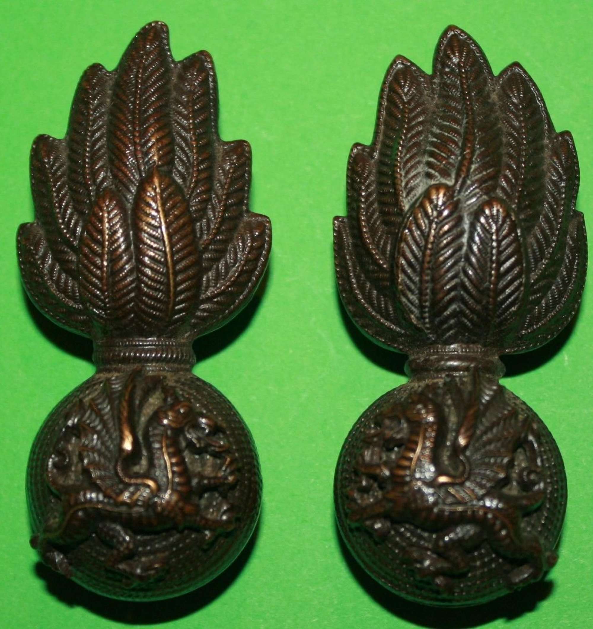 A PAIR OF OFFICERS WELSH FUSILIERS BRONZE COLLAR BADGES