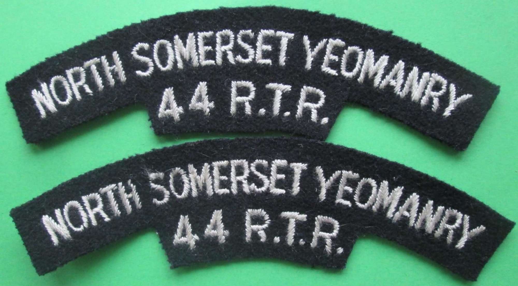 A PAIR OF SHOULDER TITLES FOR THE NORTH SOMERSET YEOMANRY