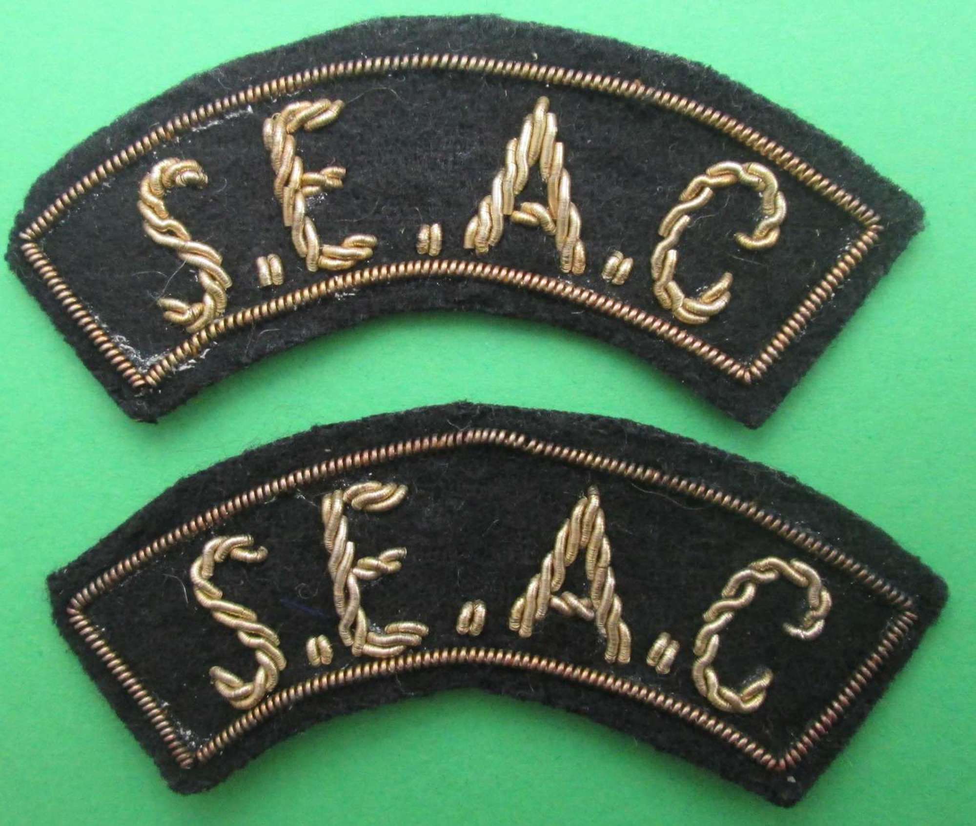 A PAIR OF SOUTH EAST ASIA COMMAND SHOULDER TITLES