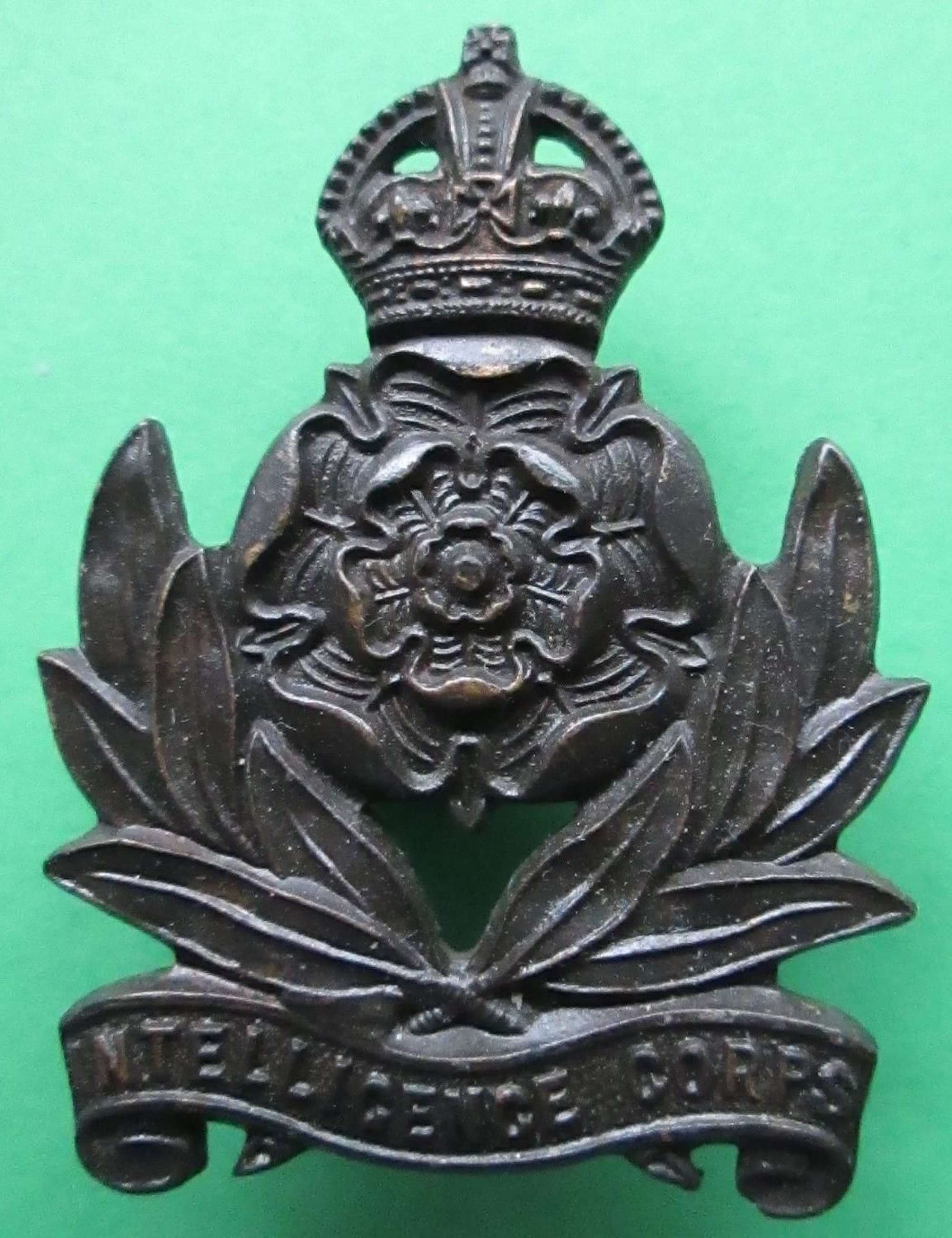 A PRE 1952 INTELLIGENCE CORPS OFFICERS BRONZE CAP BADGE