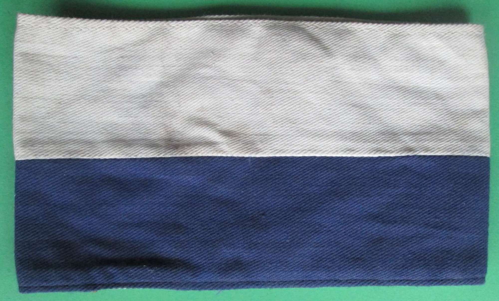 A SIGNALS BLUE AND WHITE ARM BAND