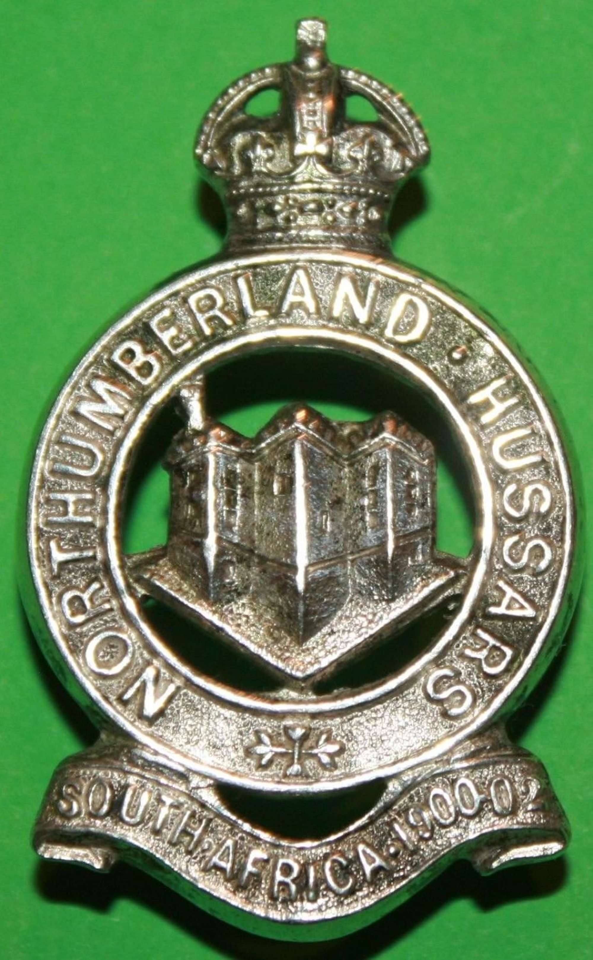 A SILVER PLATED NORTHUMBERLAND HUSSARS CAP BADGE