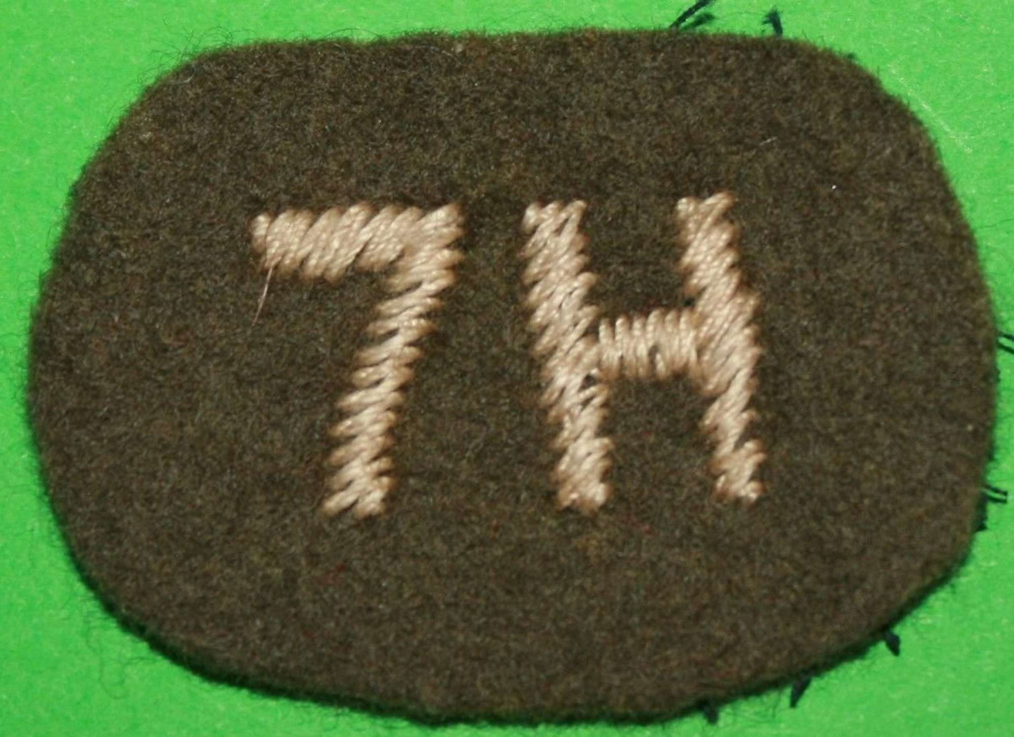 A WWII 7th HUSSARS SHOULDER TITLE