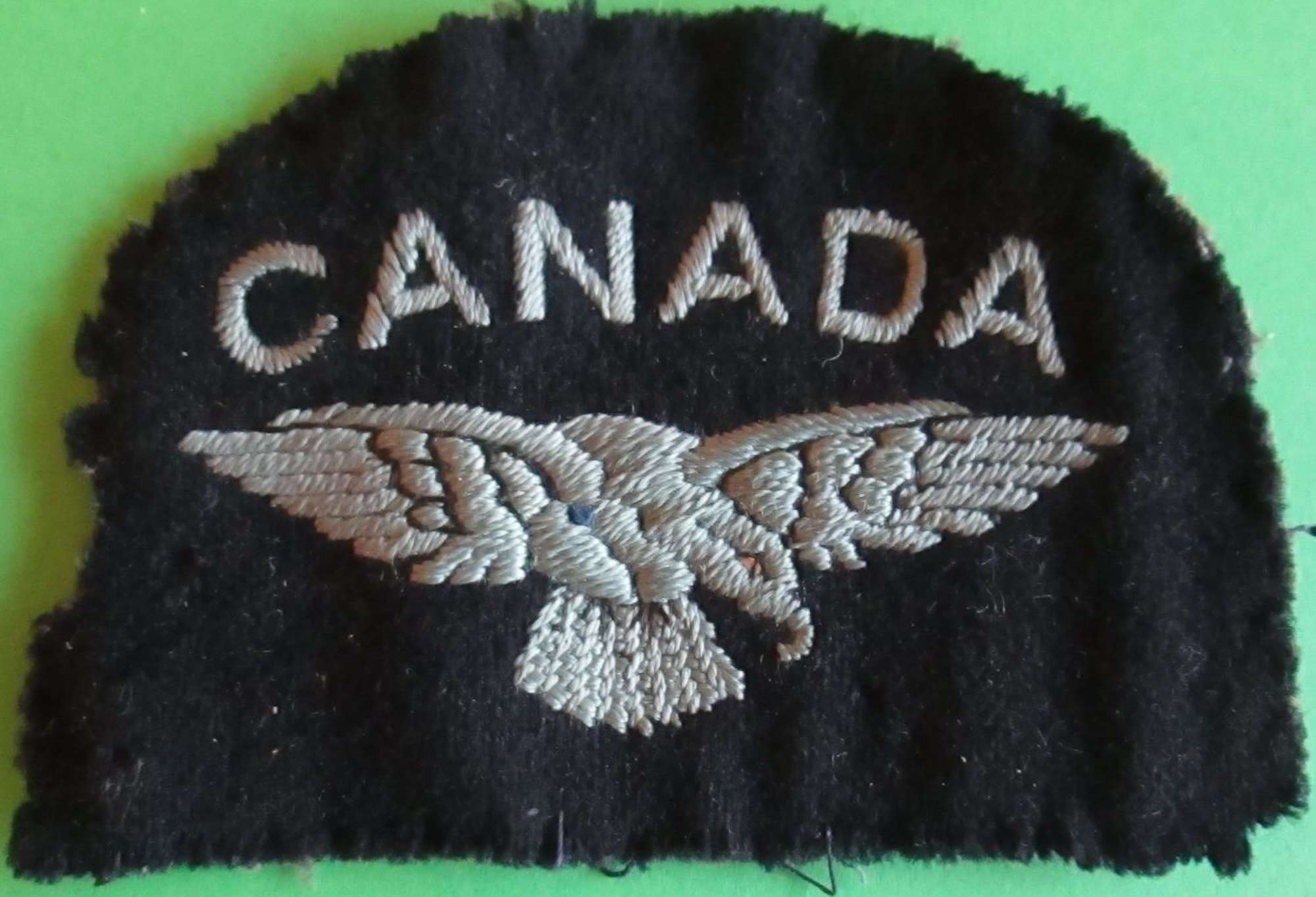 A WWII CANADIAN ROYAL AIR FORCE SHOULDER TITLE