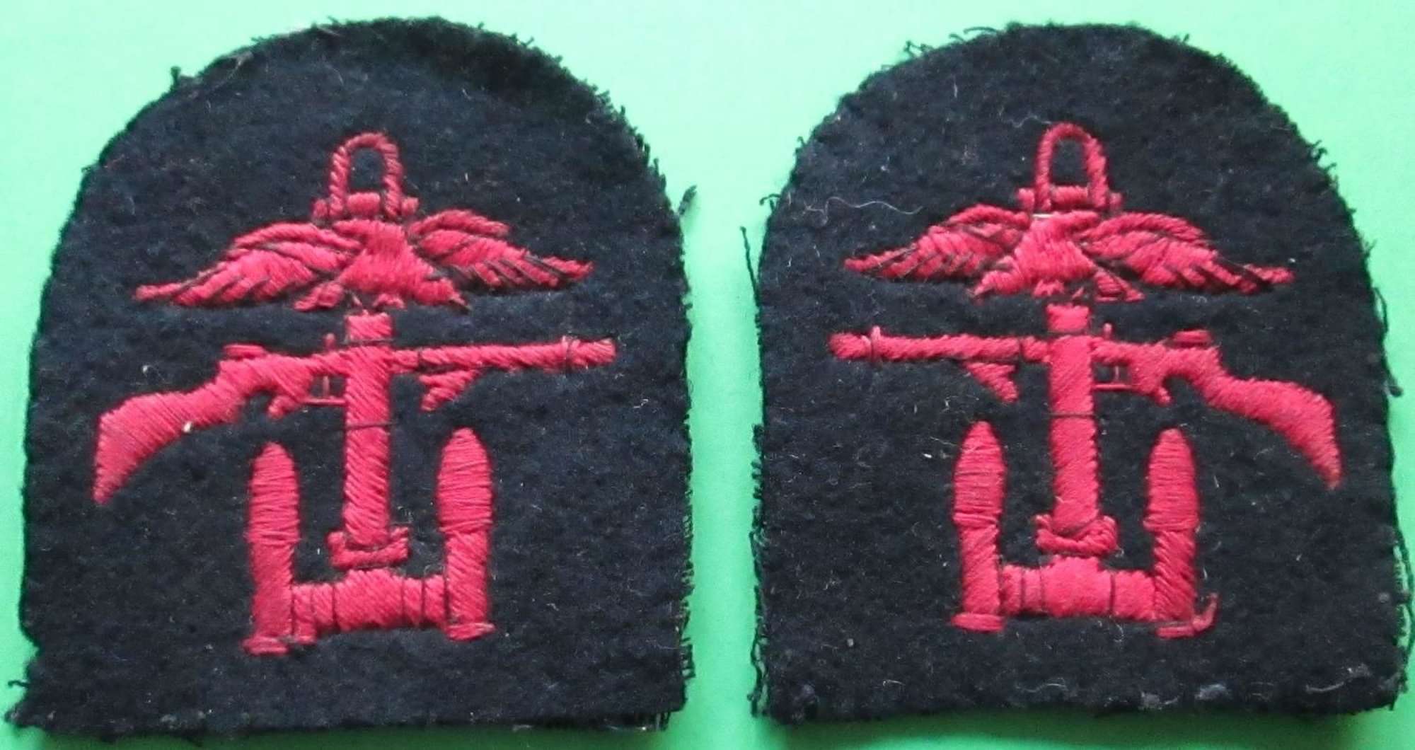 A WWII PAIR OF TOMB STONE COMBINED OPERATIONS BADGES