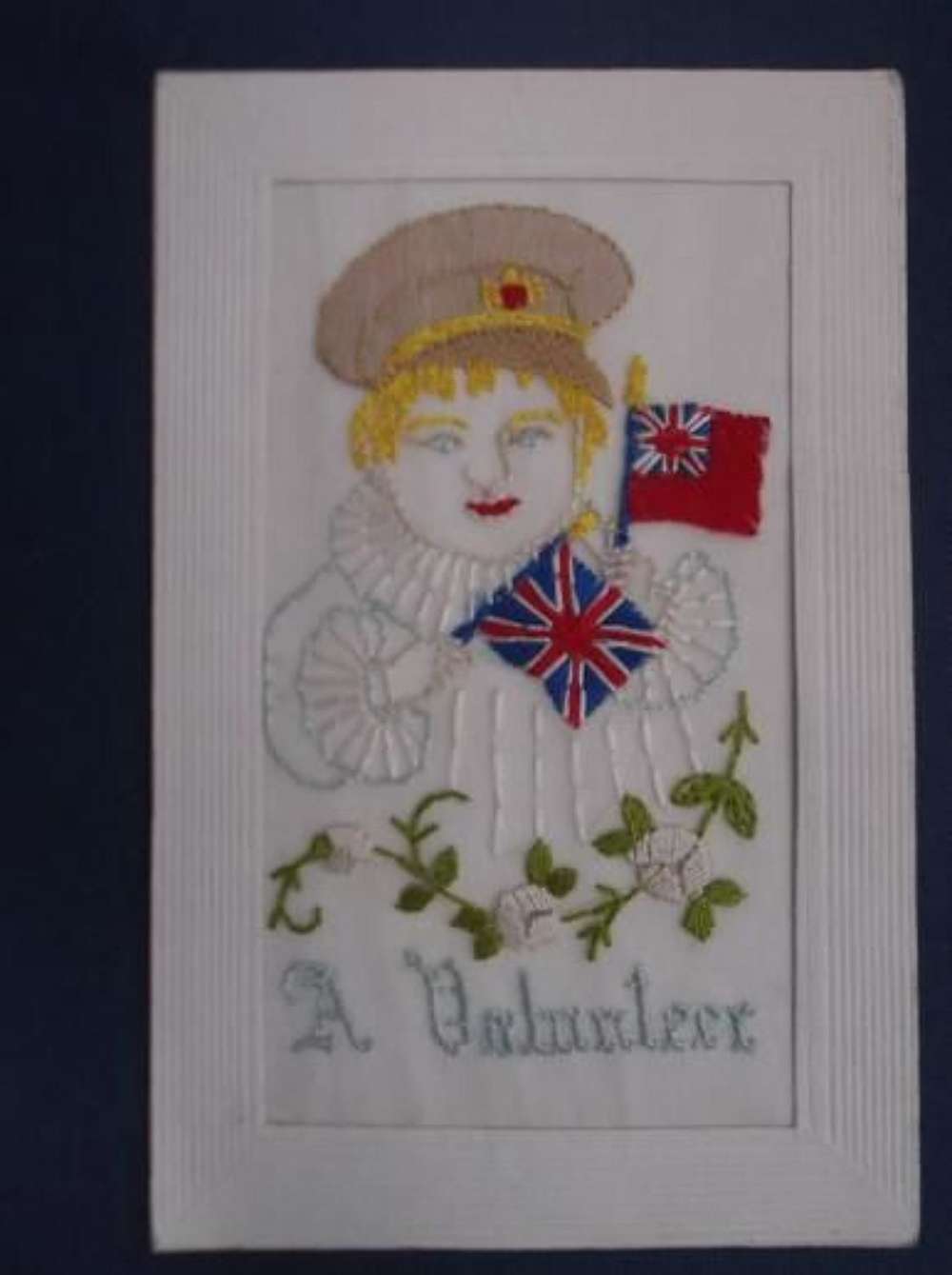 A VOLUNTEER: CHILD WEARING A BRITISH SOLDIERS CAP