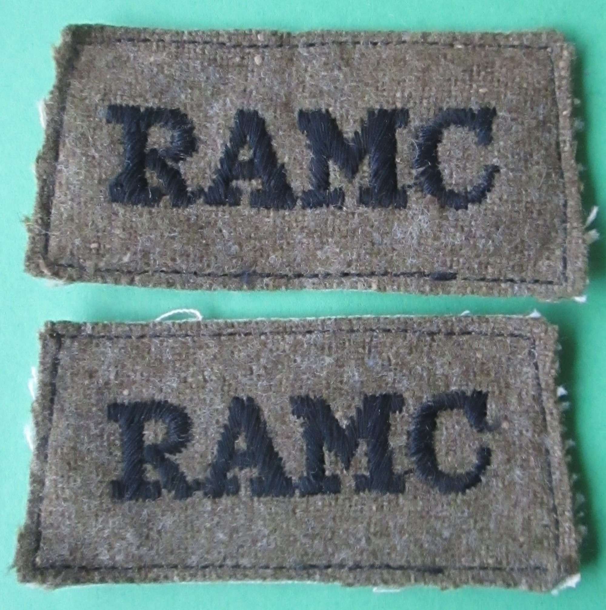 A PAIR OF ROYAL ARMY MEDICAL CORPS SLIP ON SHOULDER TITLES