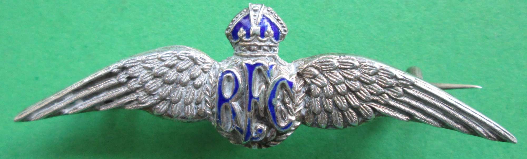 A WWI PERIOD STERLING SILVER RFC PIN BROOCH