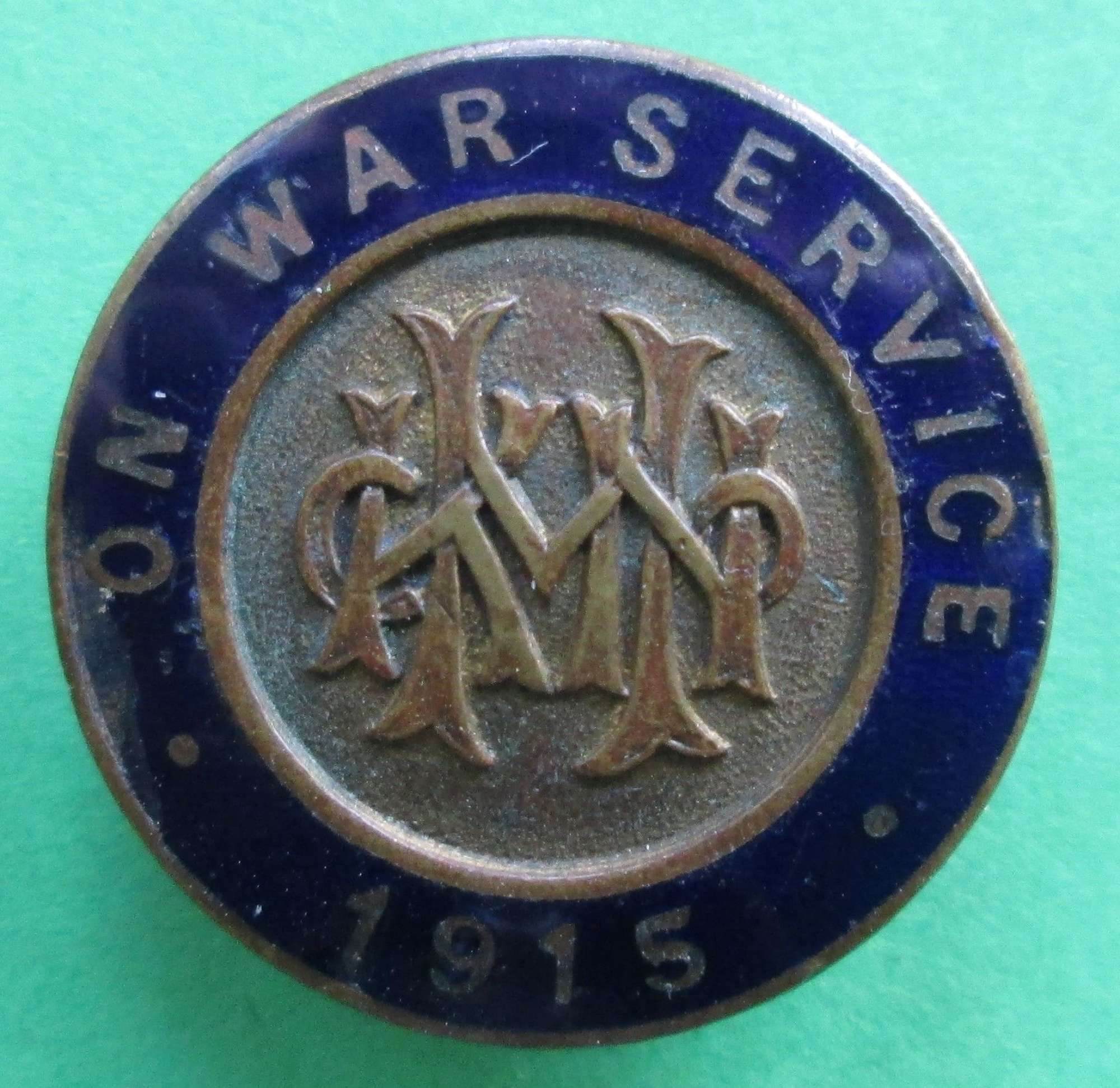 A 1915 WWI ON WAR SERVICE LAPEL BADGE