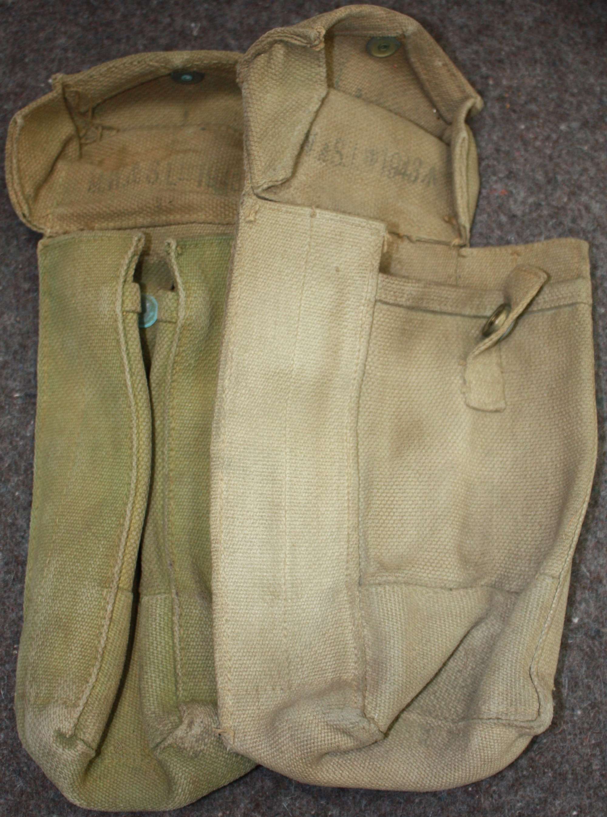 A PAIR OF MAKER MATCHING 1943 DATED 27 PATTERN AMMO POUCHES