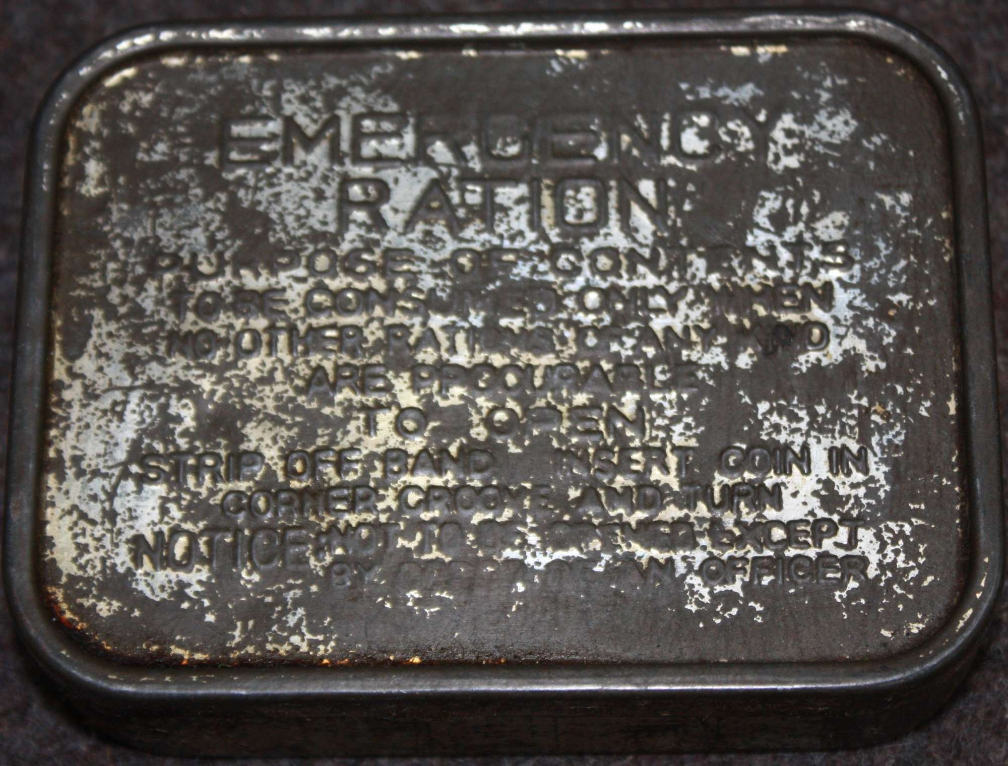 A WELL USED EXAMPLE OF THE WWII EMERGENCY RATION TIN