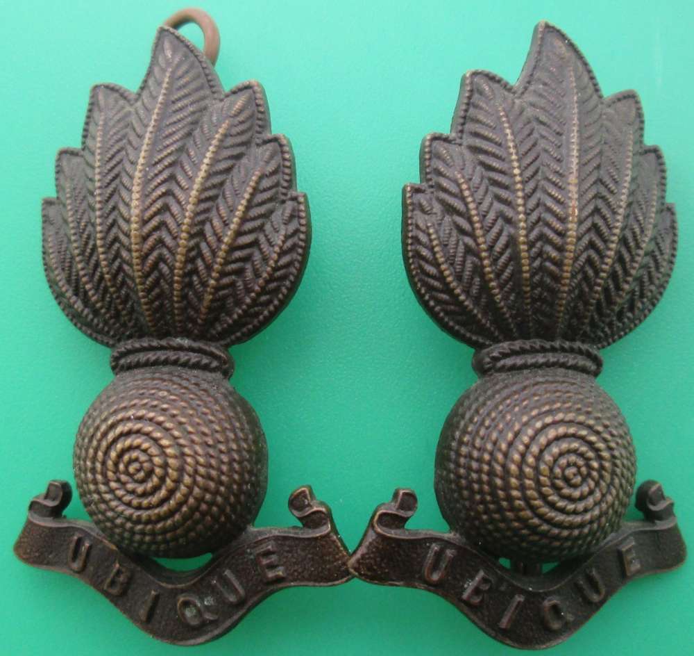 A PAIR OF ROYAL ARTILLARY COLLAR DOGS