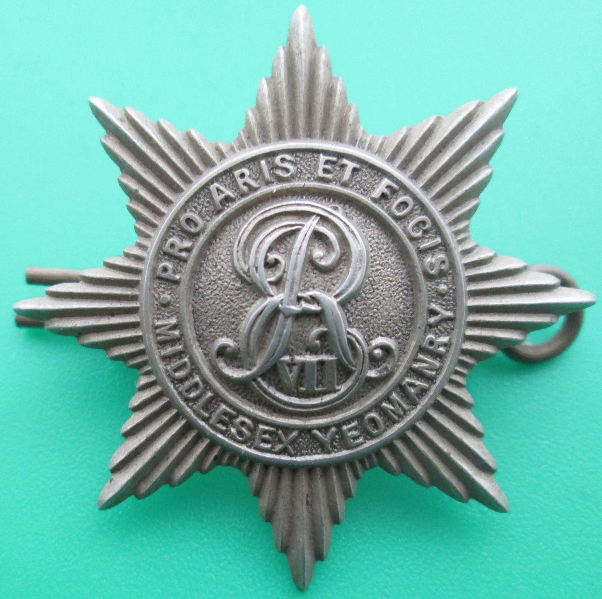 A PRE 1910 EDWARD THE 7TH MIDDLESEX YEOMANRY CAP  BADGE