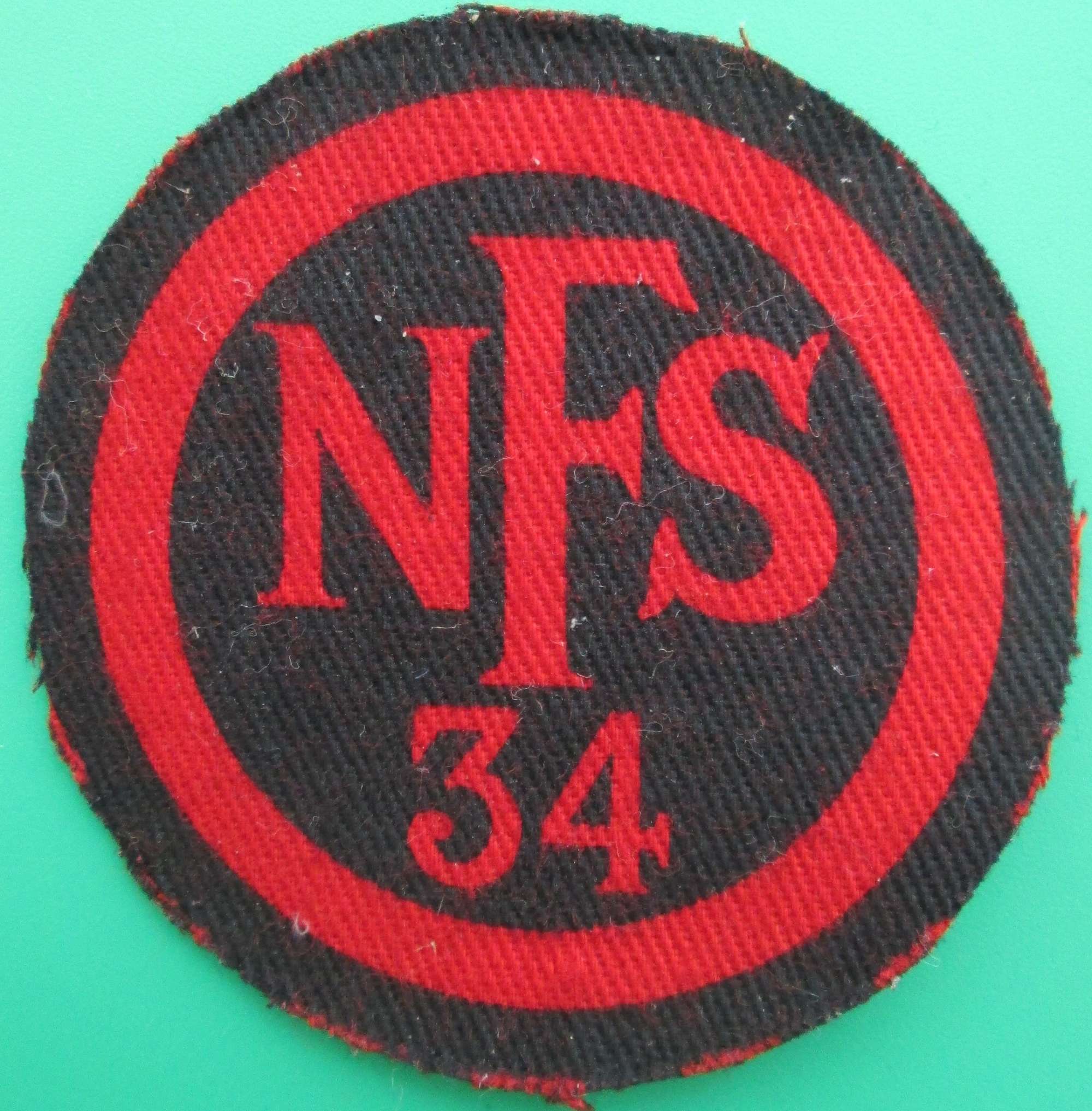 A NATIONAL FIRE SERVICE 34 AREA BADGE