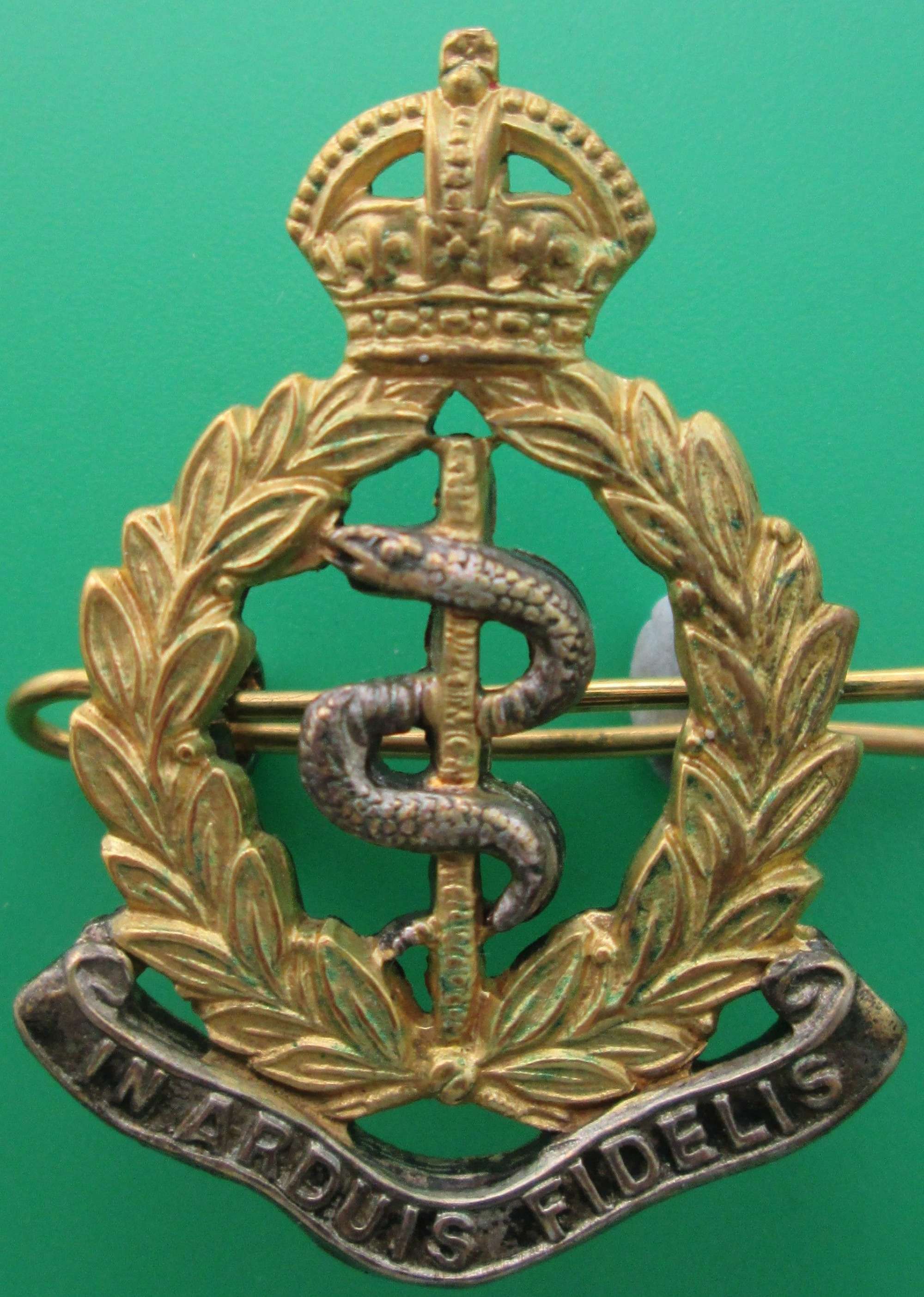 A SILVER AND GILT OFFICER'S RAMC CAP BADGE