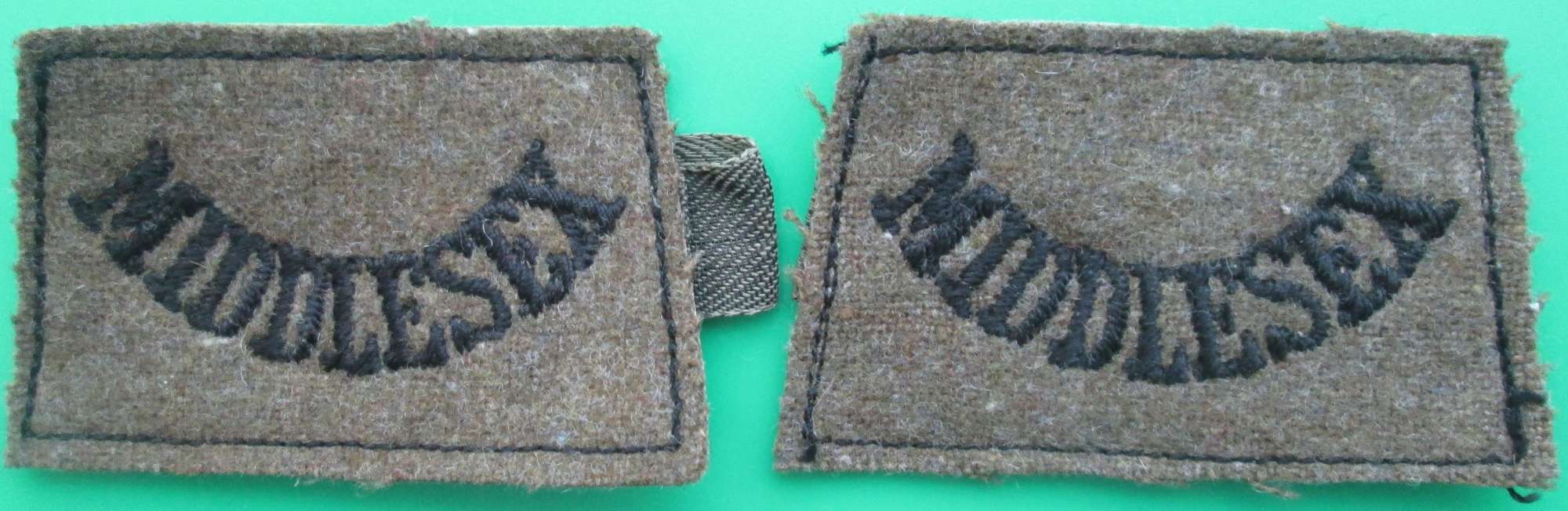 A PAIR OF MIDDLESEX REGIMENT SLIP ON TITLES