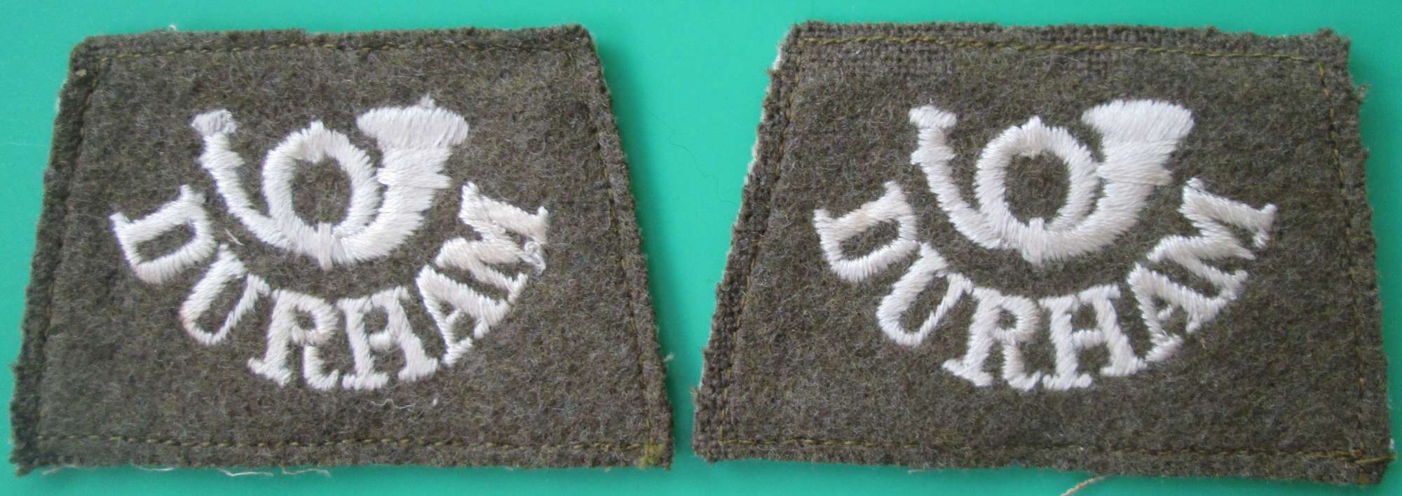 A PAIR OF WWI PERIOD DURHAM LIGHT INFANTRY SLIP ON TITLES