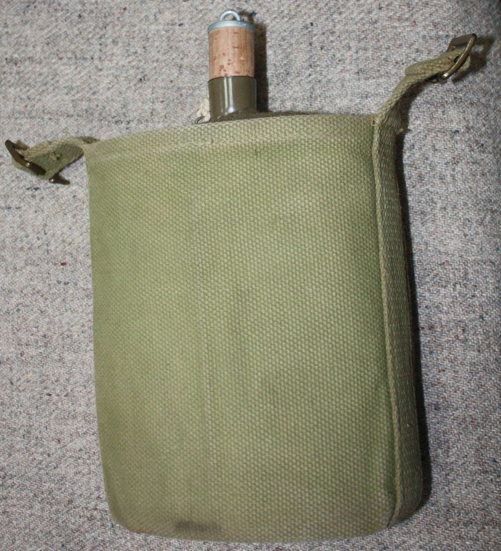 A WWII 37 PATTERN WATER BOTTLE AND CRADLE