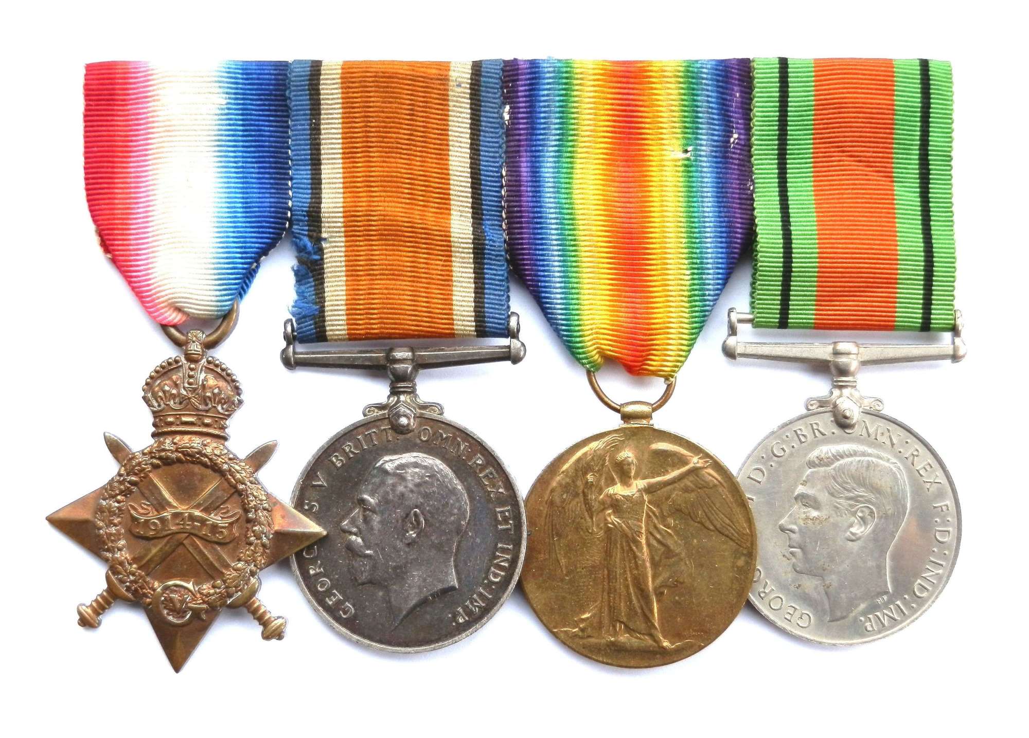 GROUP OF FOUR. Sjt George S. Evans. The Queen’s Regiment.