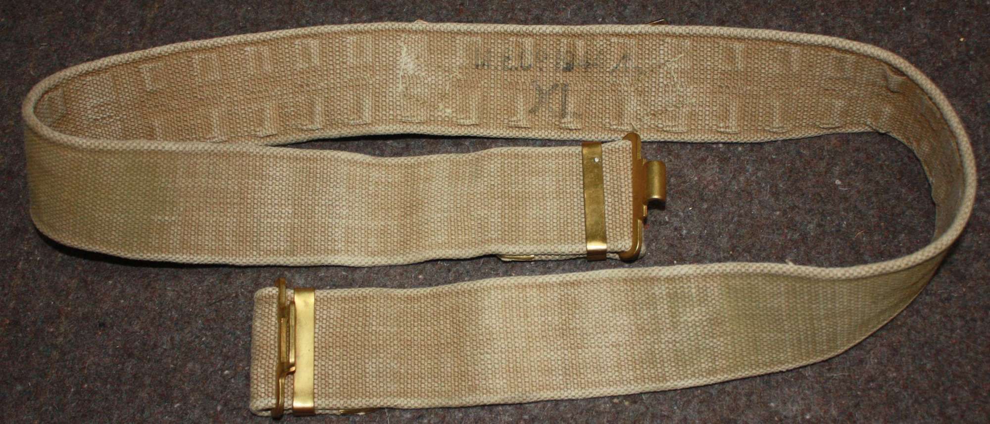 A WWII 1944 MECO MADE LARGE SIZE 37 PATTERN WEBBING BELT