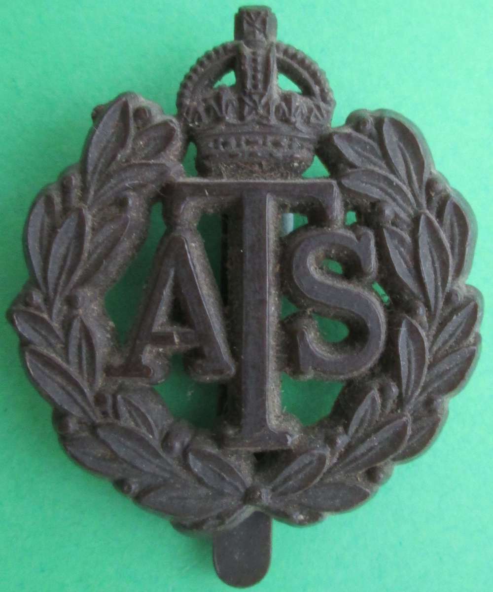 AN AUXILLARY TERRITORIAL SERVICE PLASTIC CAP BADGE