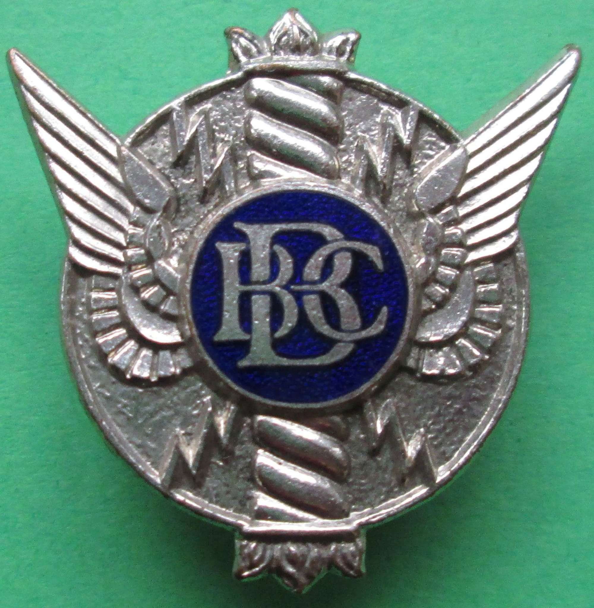 A GOOD WWII PERIOD BBC LAPEL BADGE HALF MOON FIXING TO THE REVERSE