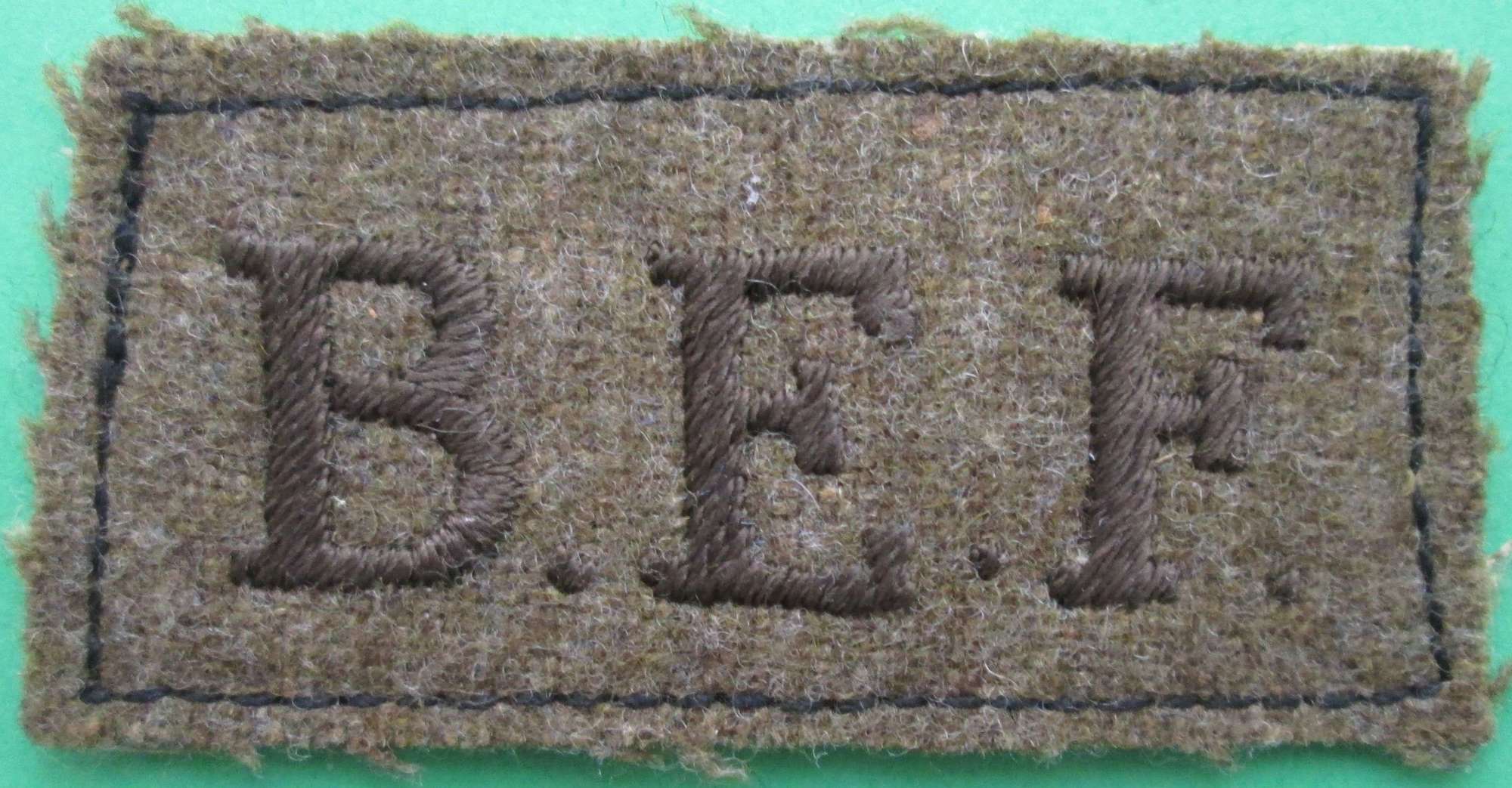 A SLIP ON SHOULDER TITLE FOR THE BRITISH EXPEDITIONARY FORCE