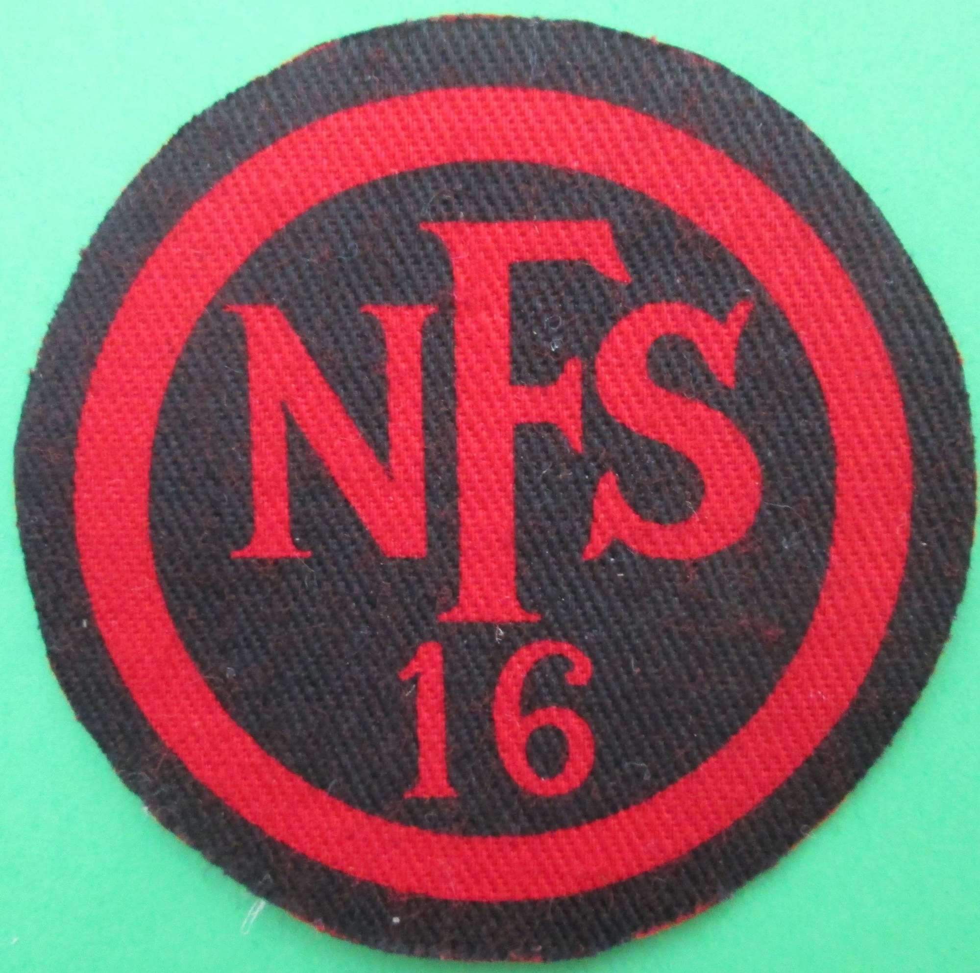 A NATIONAL FIRE SERVICE BREAST BADGE