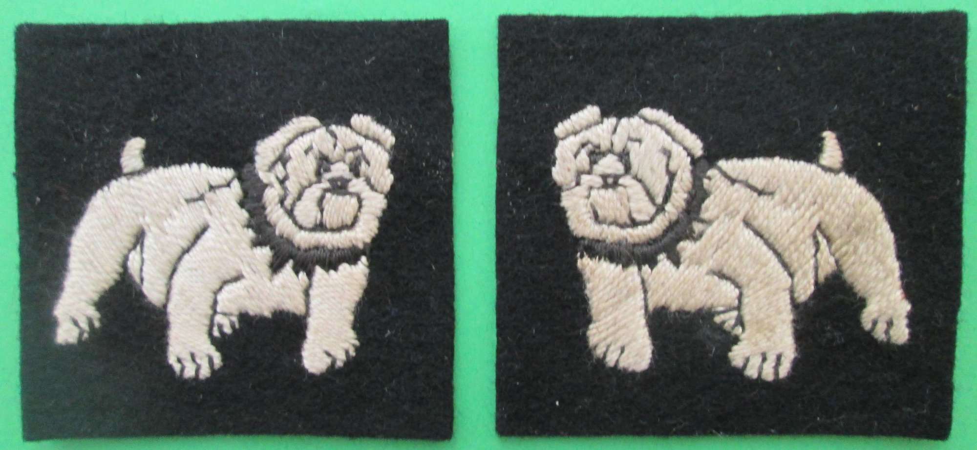 A PAIR OF WOVEN FORMATION SIGNS FOR THE EASTERN COMMAND
