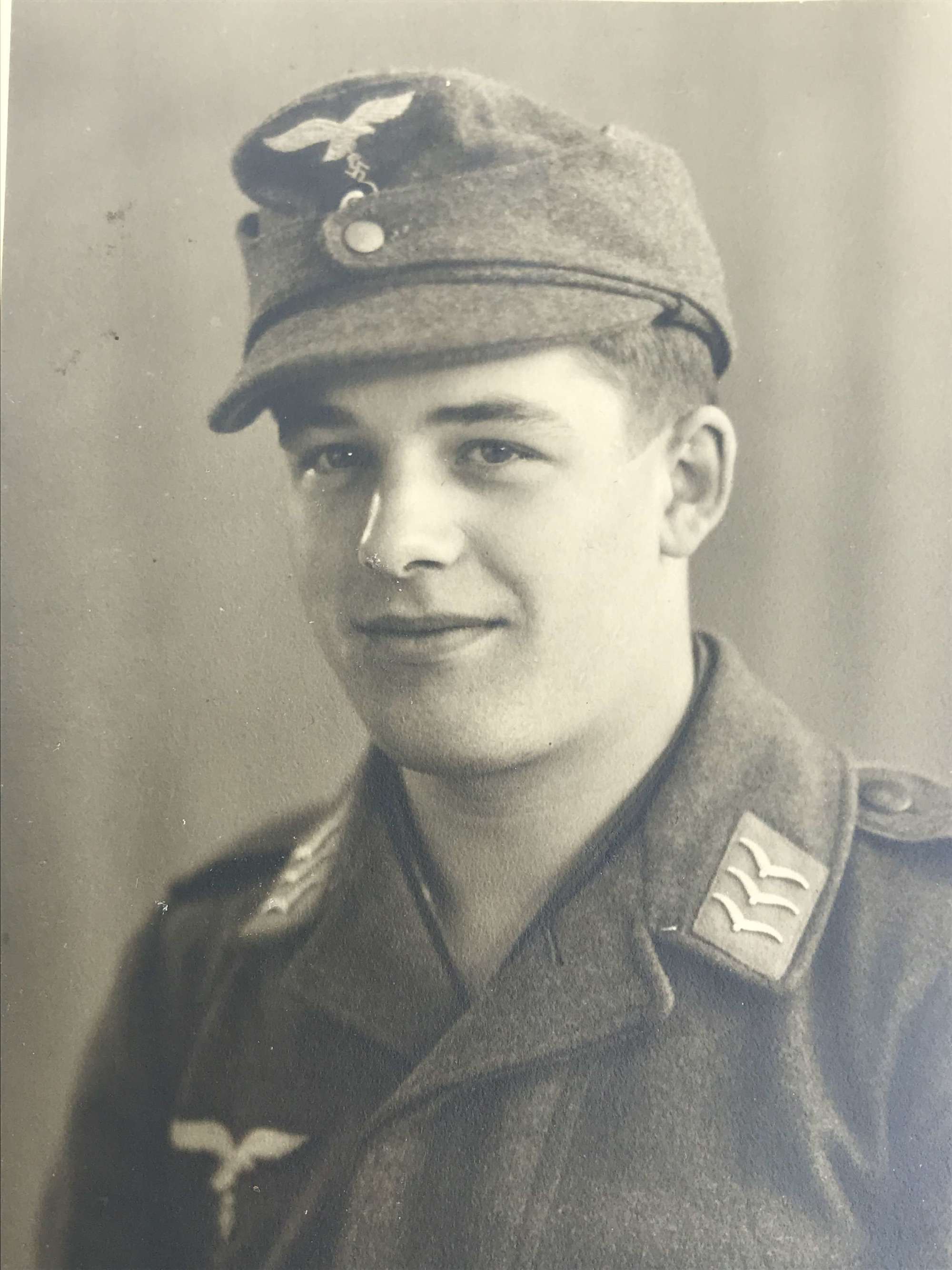 Portrait image of a Fallschirmjager  wearing M43 cap
