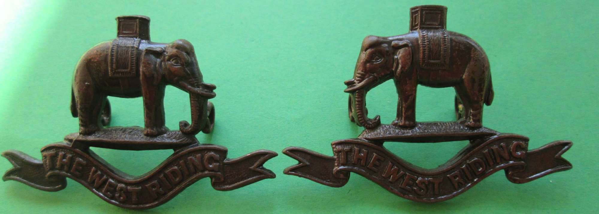 A PAIR OF WEST RIDING OFFICERS BRONZE COLLAR DOGS