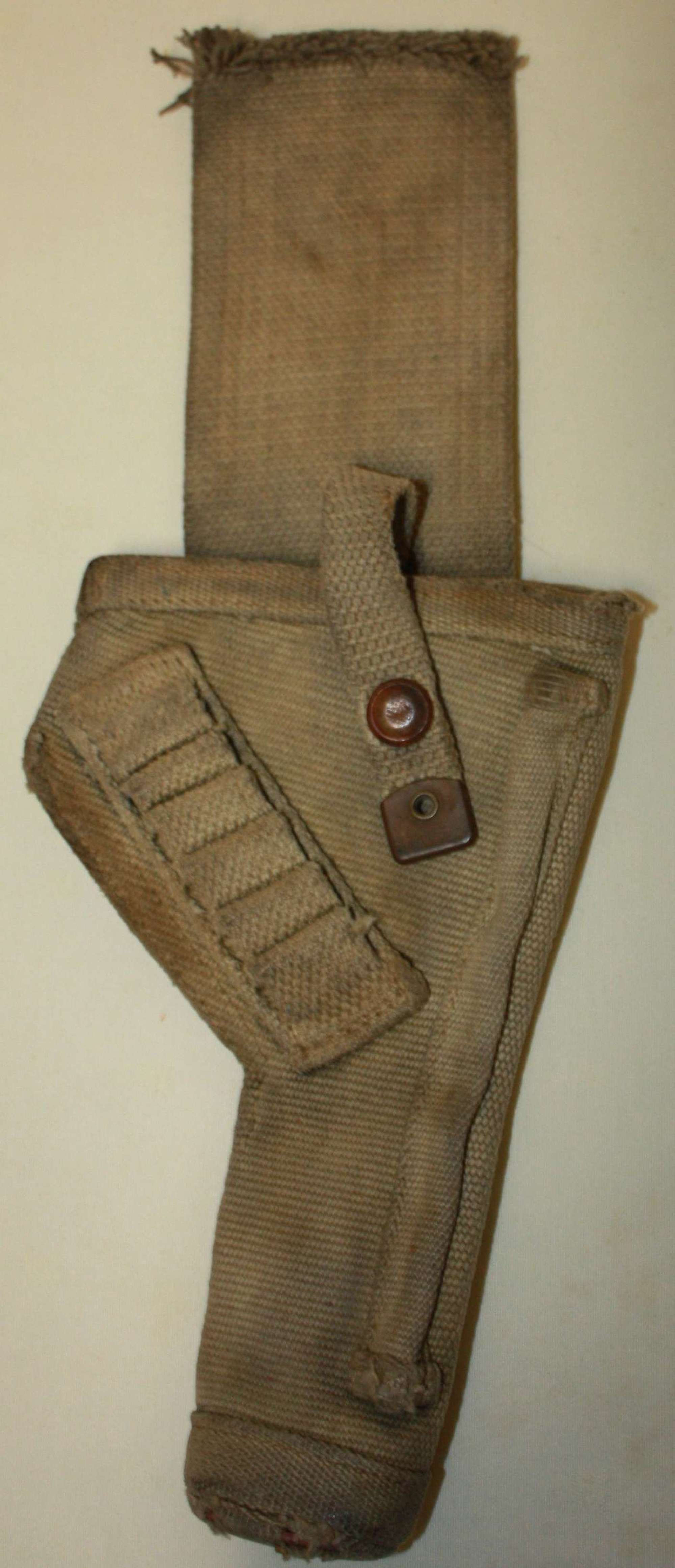 A BRITISH 1938 DATED TANK HOLSTER WITH THE TOP STRAP CUT DOWN