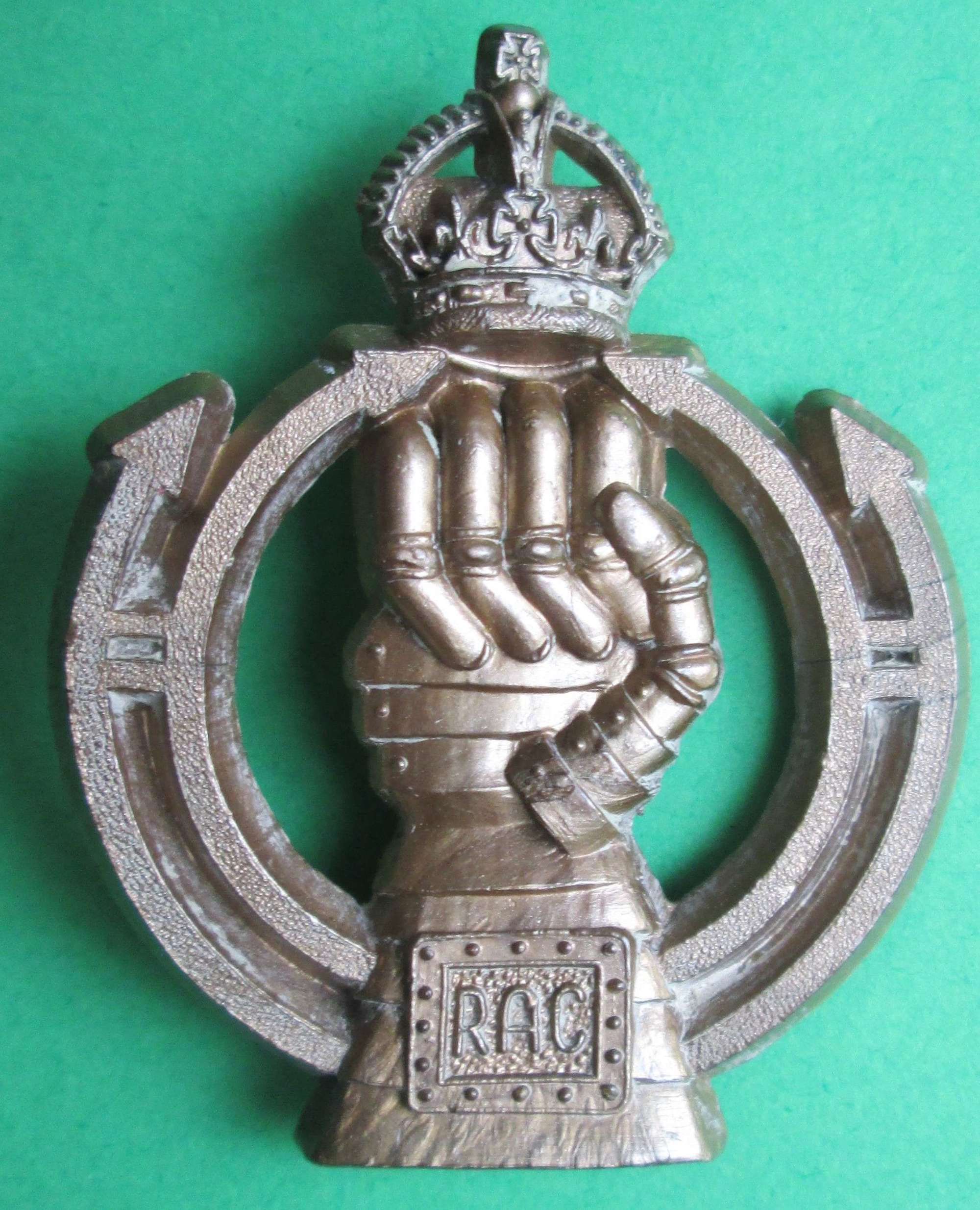 A ROYAL ARMOURED CORPS PLASTIC CAP BADGE