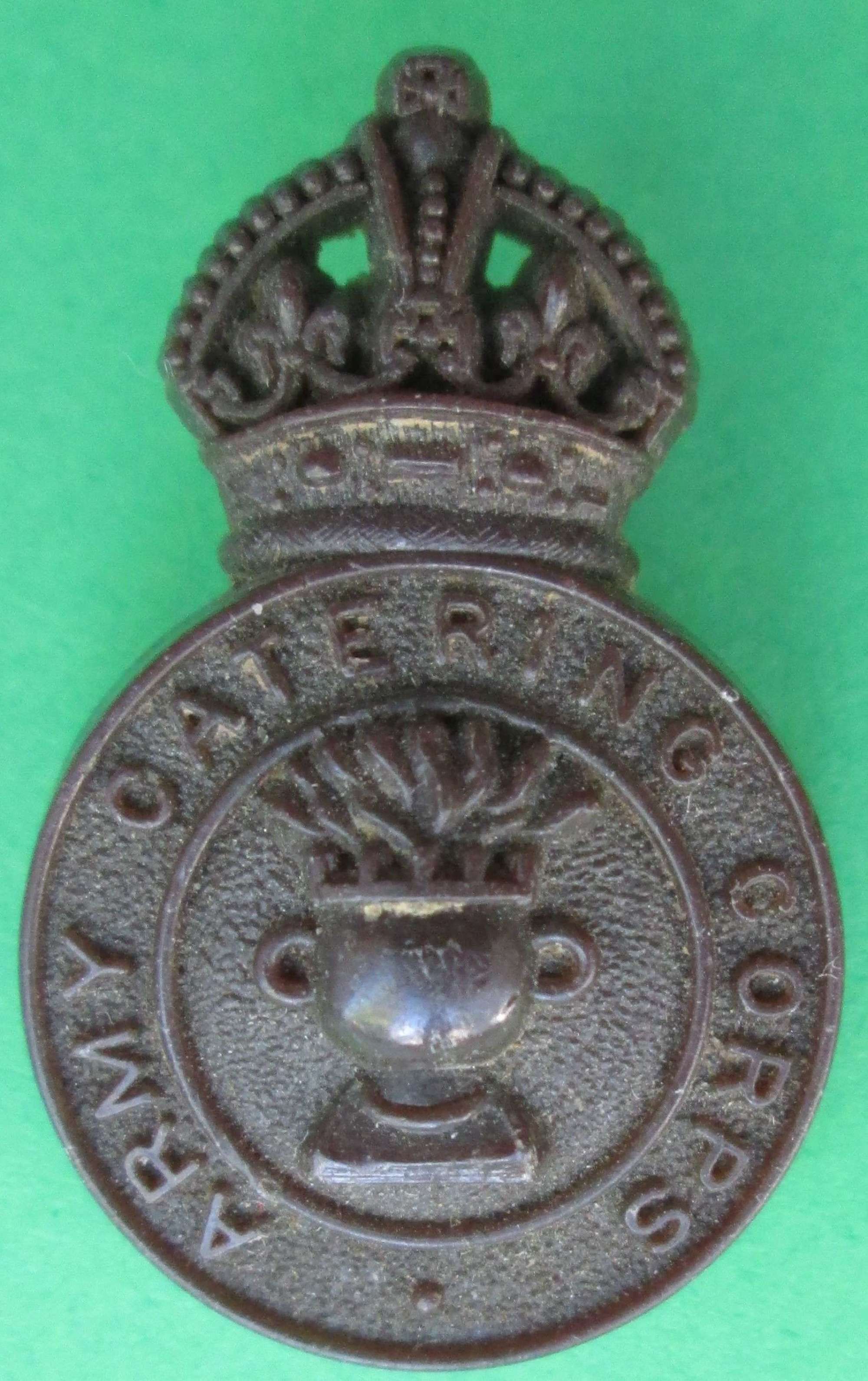 A PLASTIC ARMY CATERING CORPS BADGE