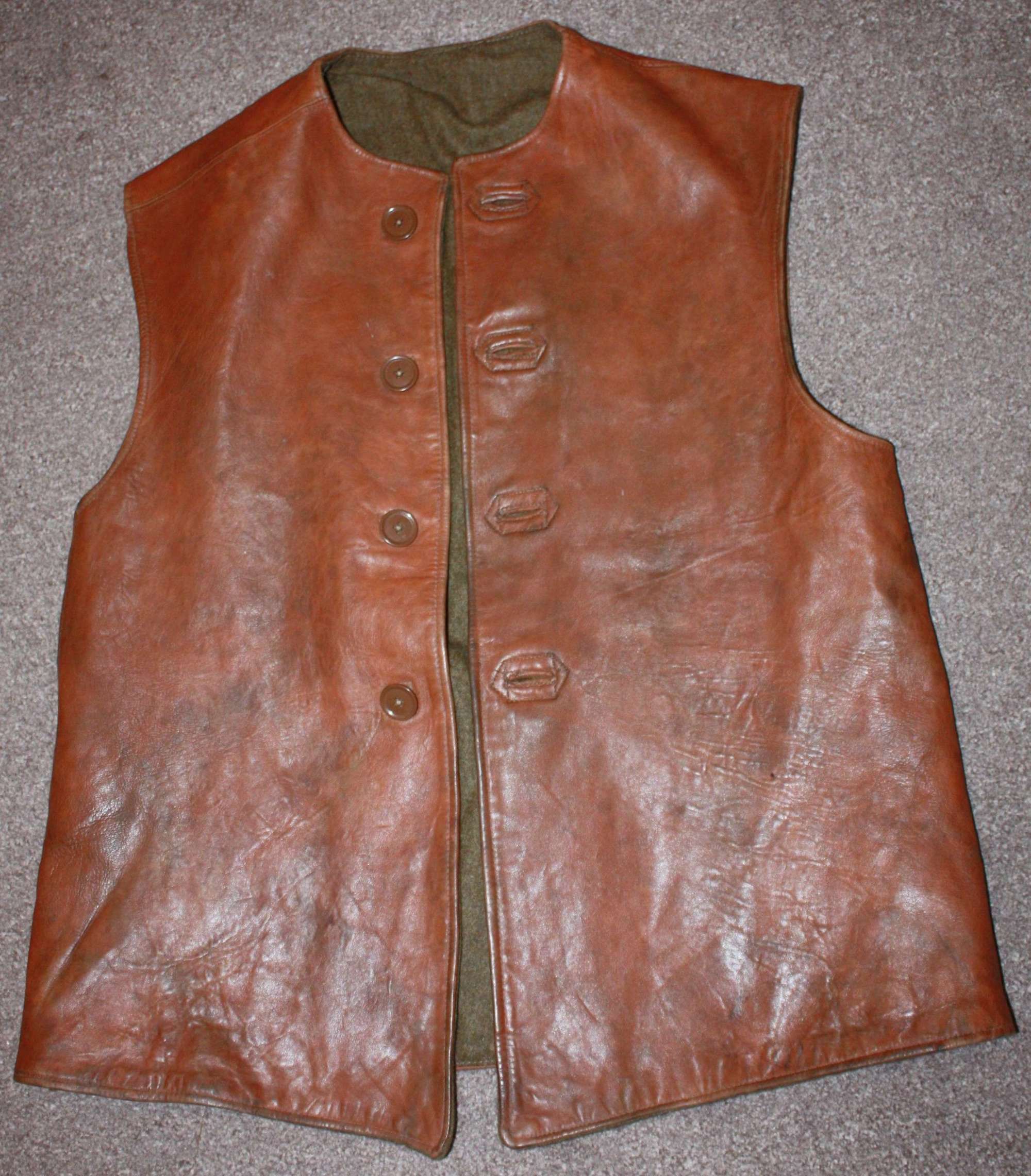 A GOOD 1945 DATED LEATHER JERKIN SIZE 2 CAMOUFLAGE  EXAMPLE