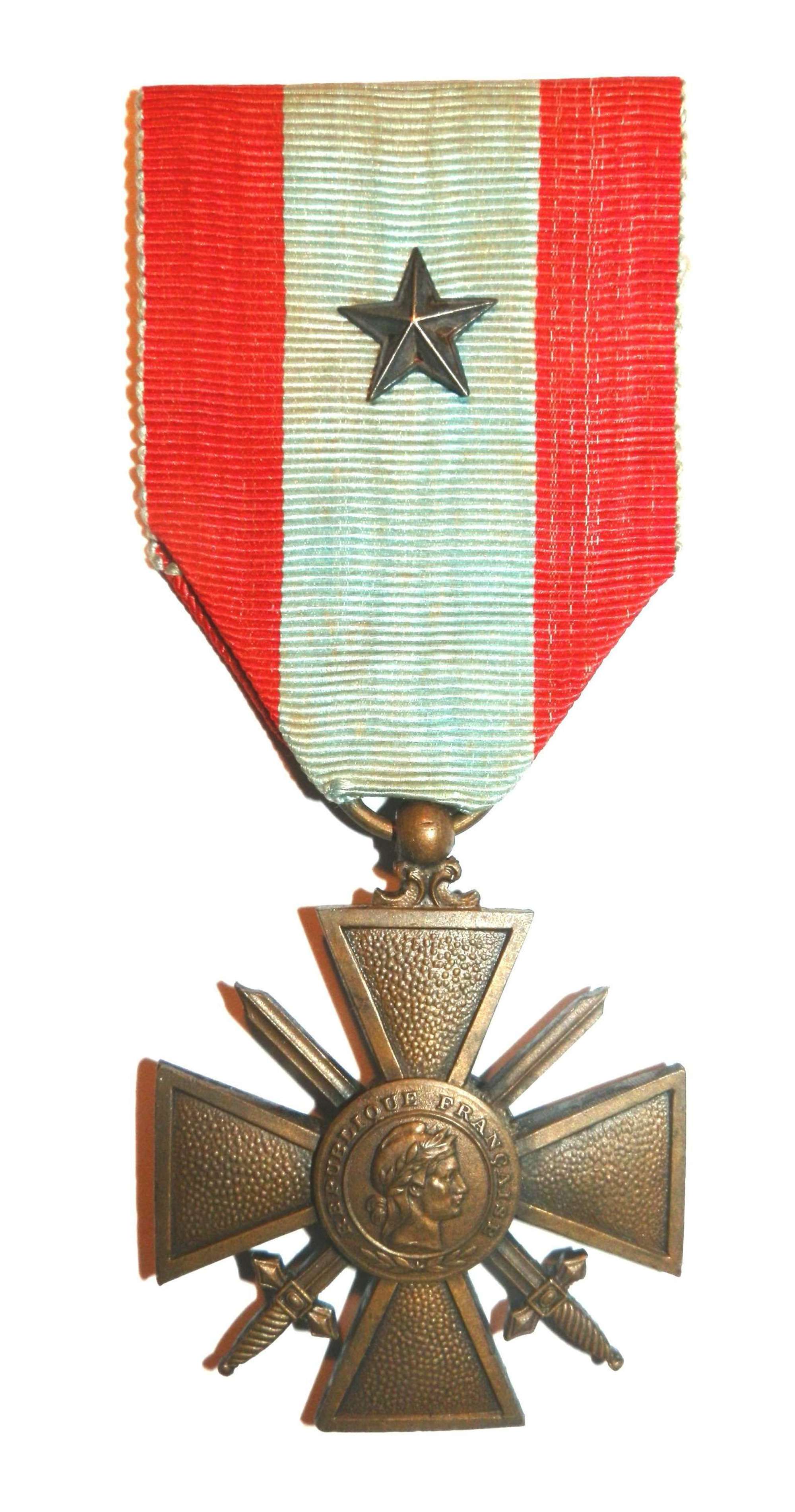 The War Cross T.O.E. Croix de Guerre, Theatre of Operations Award.