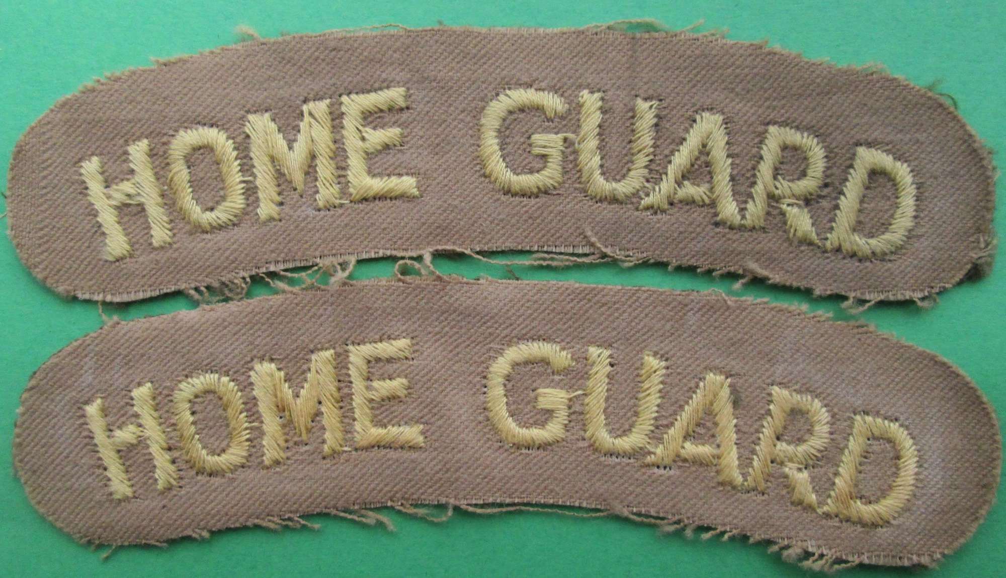 A PAIR OF WWII HOME GUARD SHOULDER TITLES