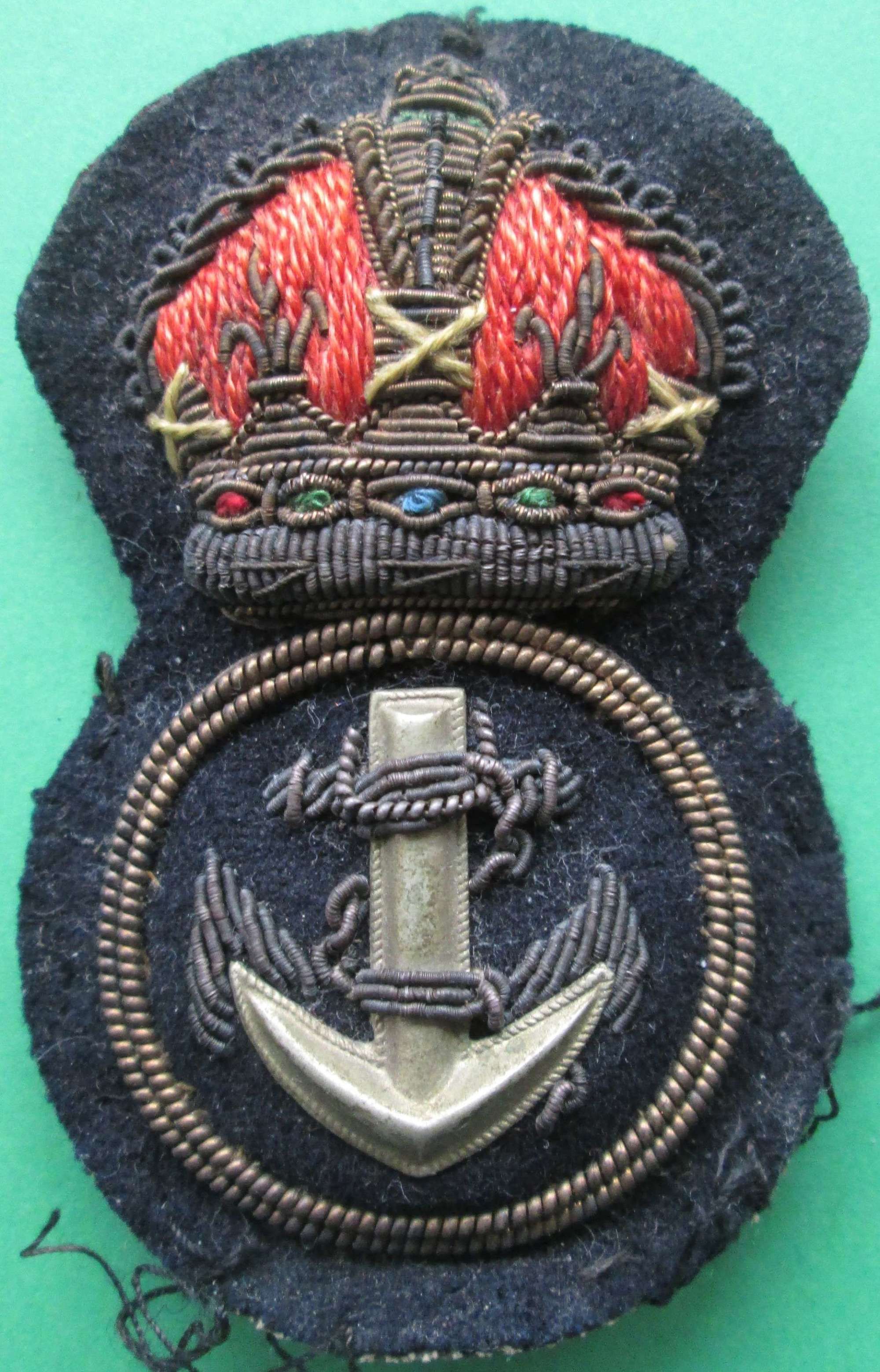 A NAVAL CHIEF PETTY OFFICER'S CAP BADGE