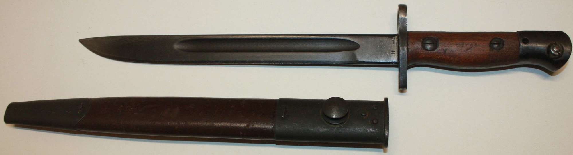 A GOOD ORANGE ARSNEL MADE 1944 DATED OWEN SUBMACHINE GUN BAYONET