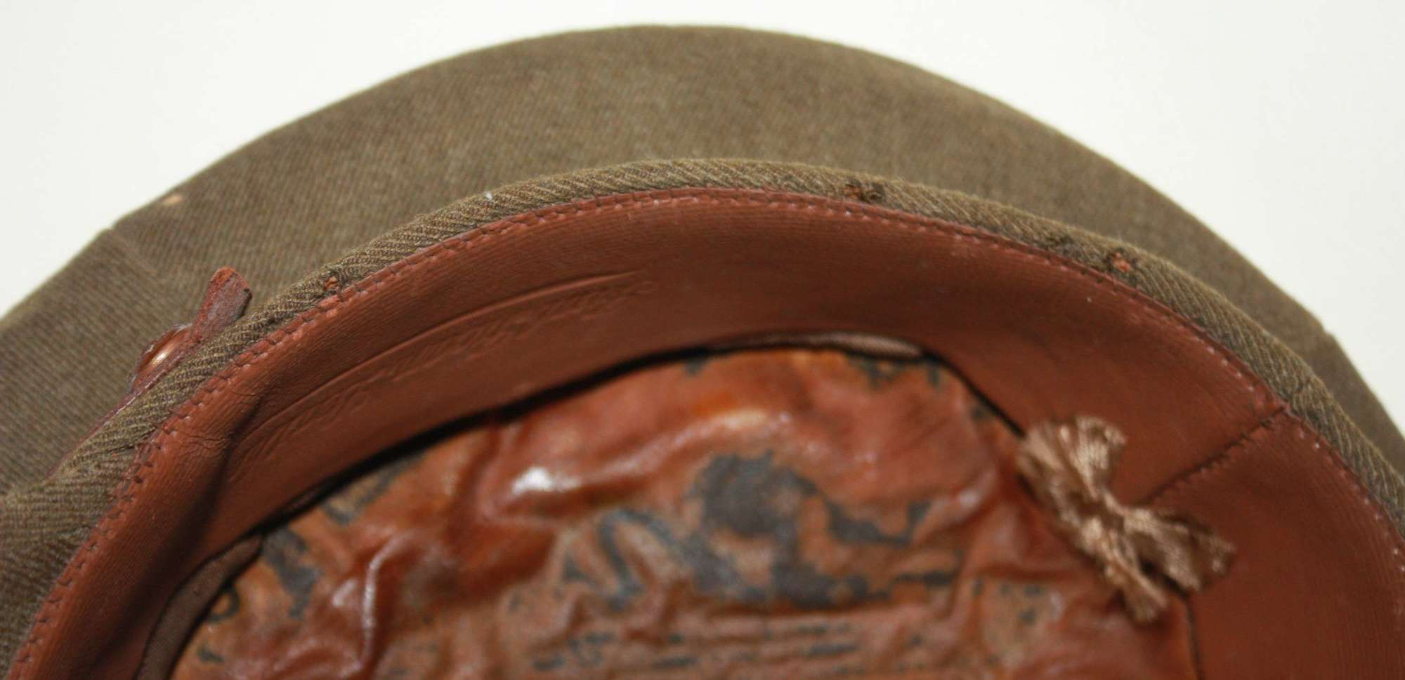A GOOD USED WWII PERIOD OFFICERS PEAKED CAP