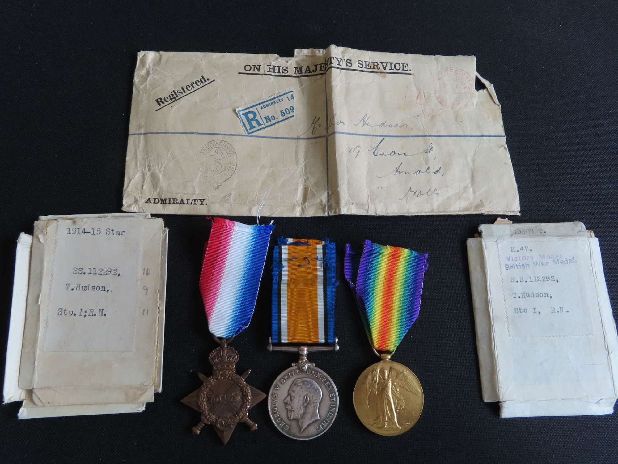 WW1 Navy trio of medals, Boxes and postage envelope to T. Hudson