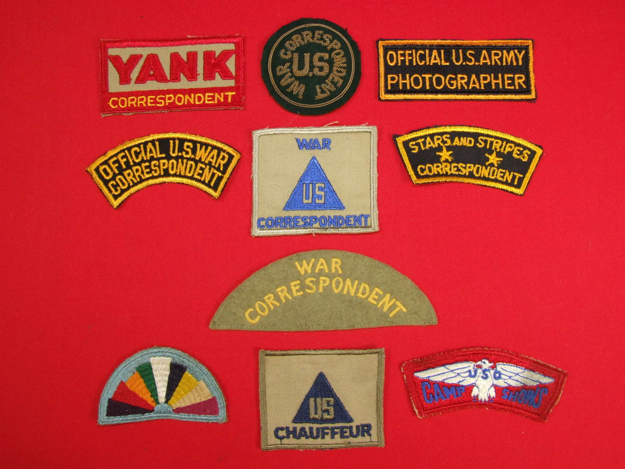 A collection of 7 U.S War Correspondent badges and 3 others.
