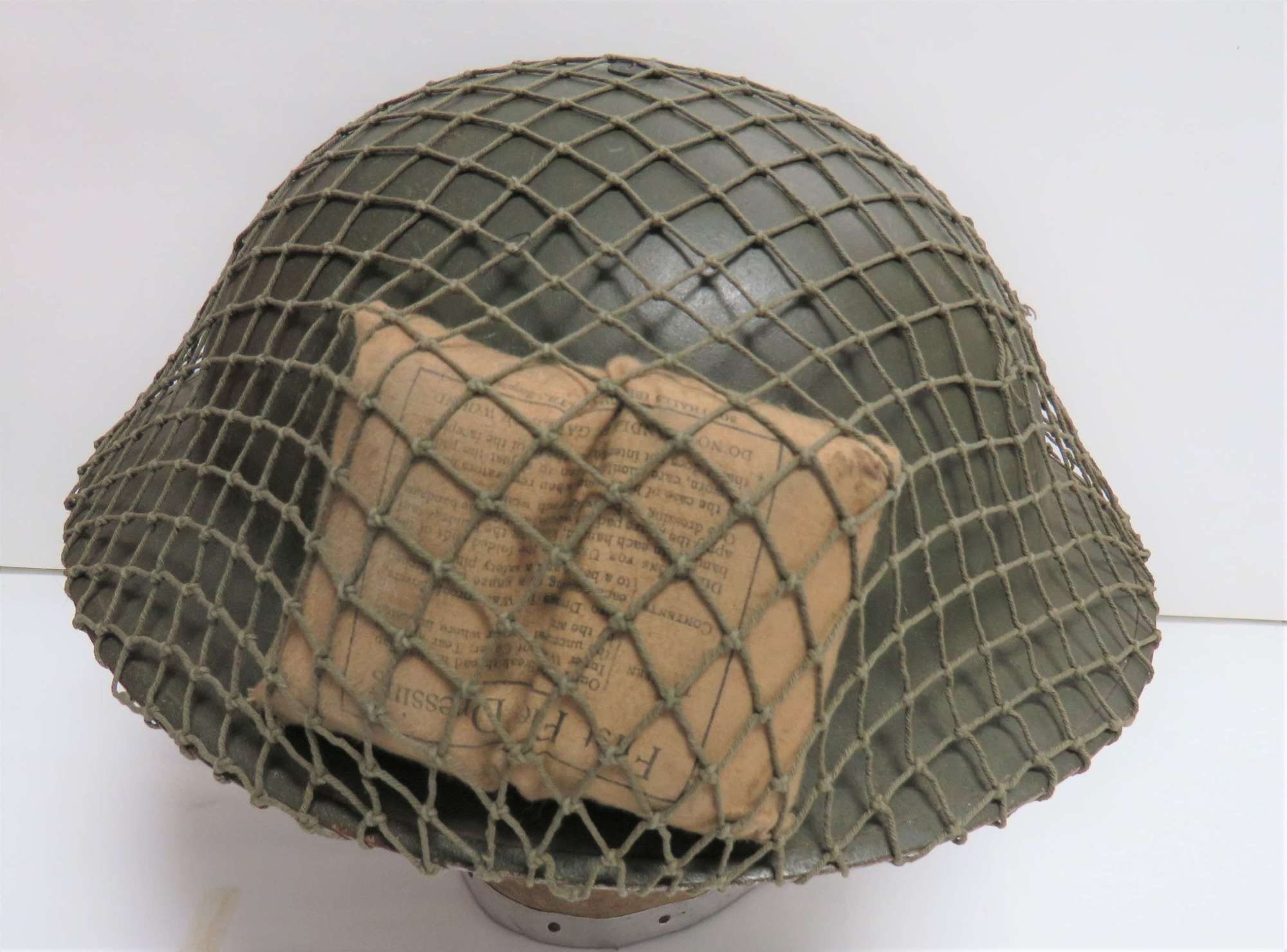 Early War Steel Helmet with cammo cover and First Aid Dressing