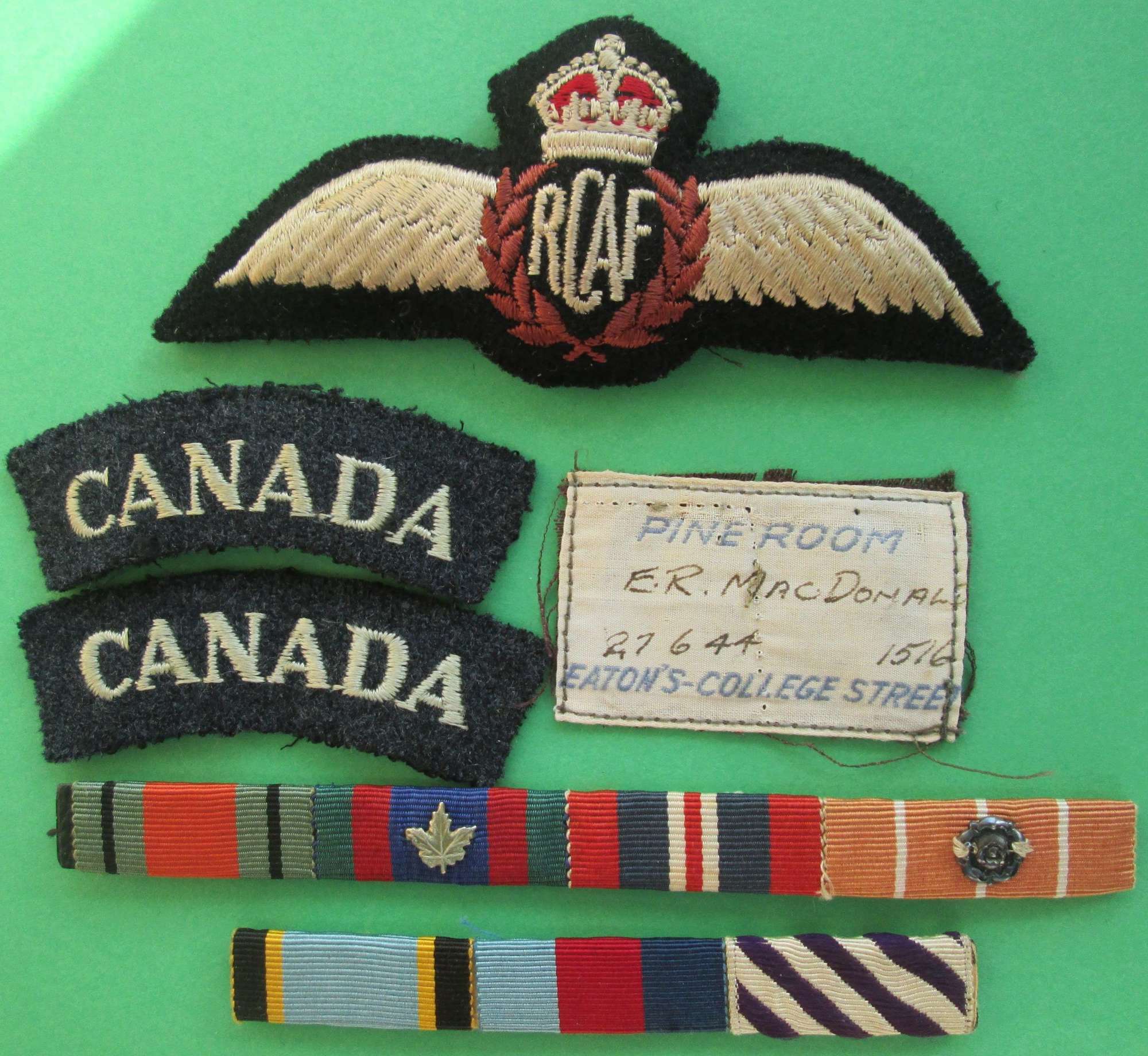 WWII RCAF WINGS , SHOULDER TITLES , MEDAL RIDDONS AND JACKET LABEL